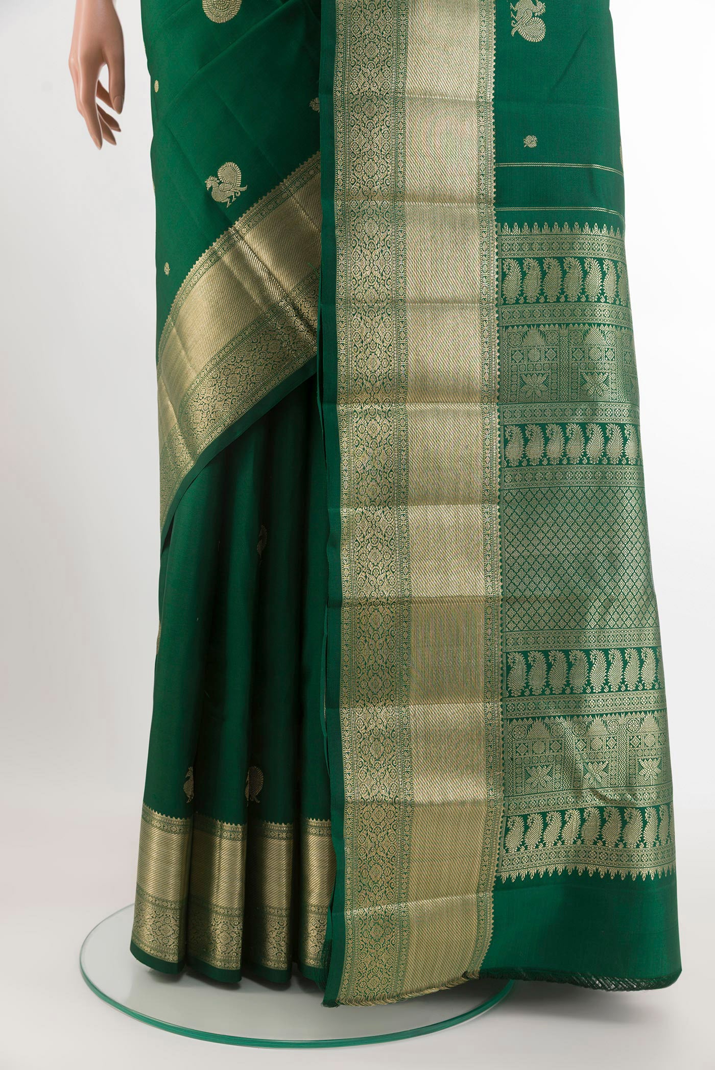 Pleats and pallu of Green Kanjivaram Silk Saree with Zari Butta on the body and Zari Border. 