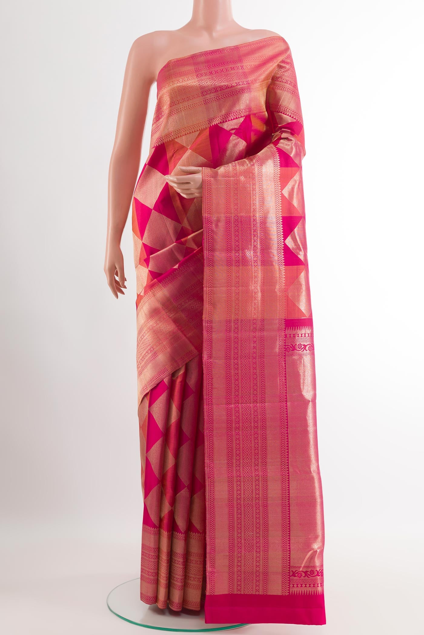 Rani Pink Kanchipuram Silk Saree with Zari Brocade on the body and Zari Border.  displayed on a mannequin