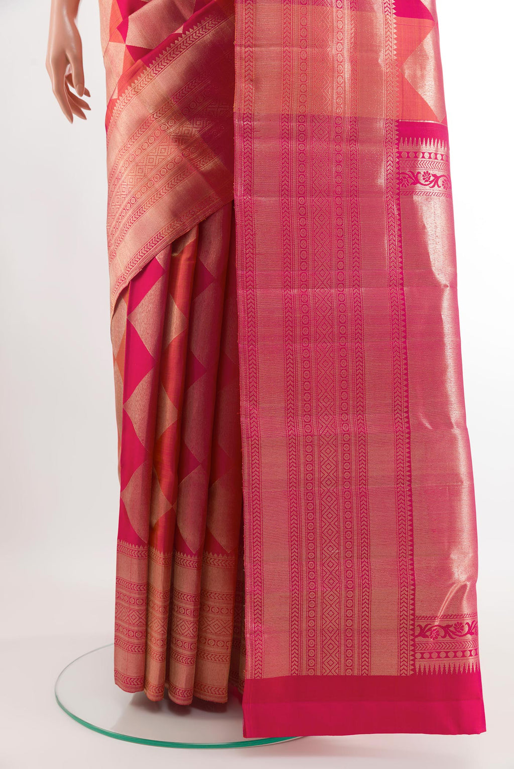 Pleats and pallu of Rani Pink Kanchipuram Silk Saree with Zari Brocade on the body and Zari Border. 