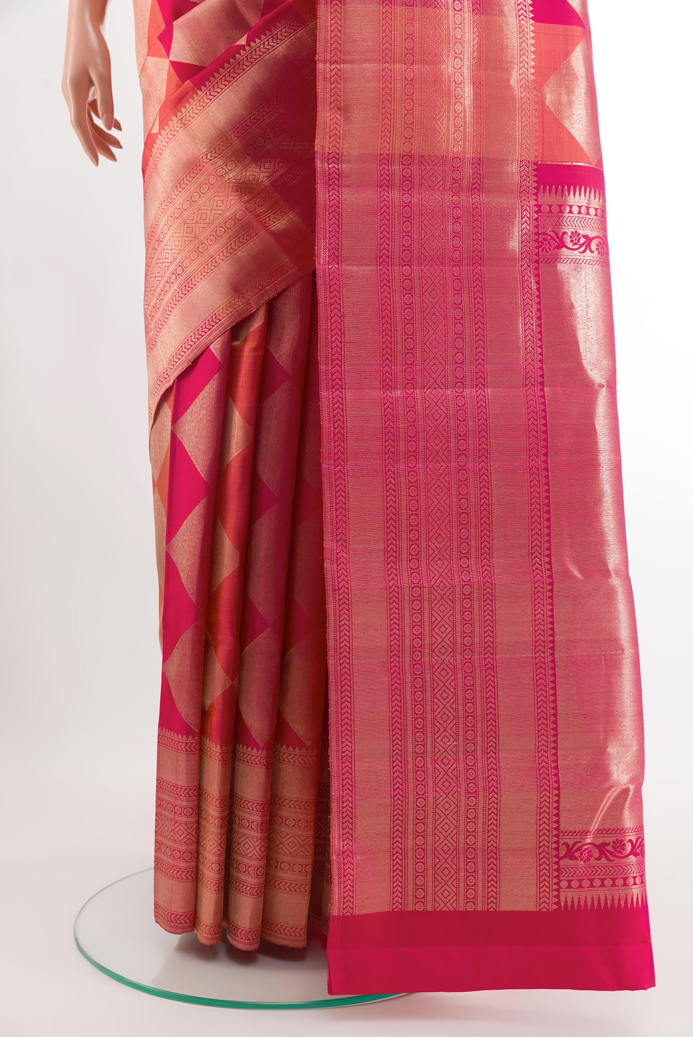 Pleats and pallu of Rani Pink Kanchipuram Silk Saree with Zari Brocade on the body and Zari Border. 