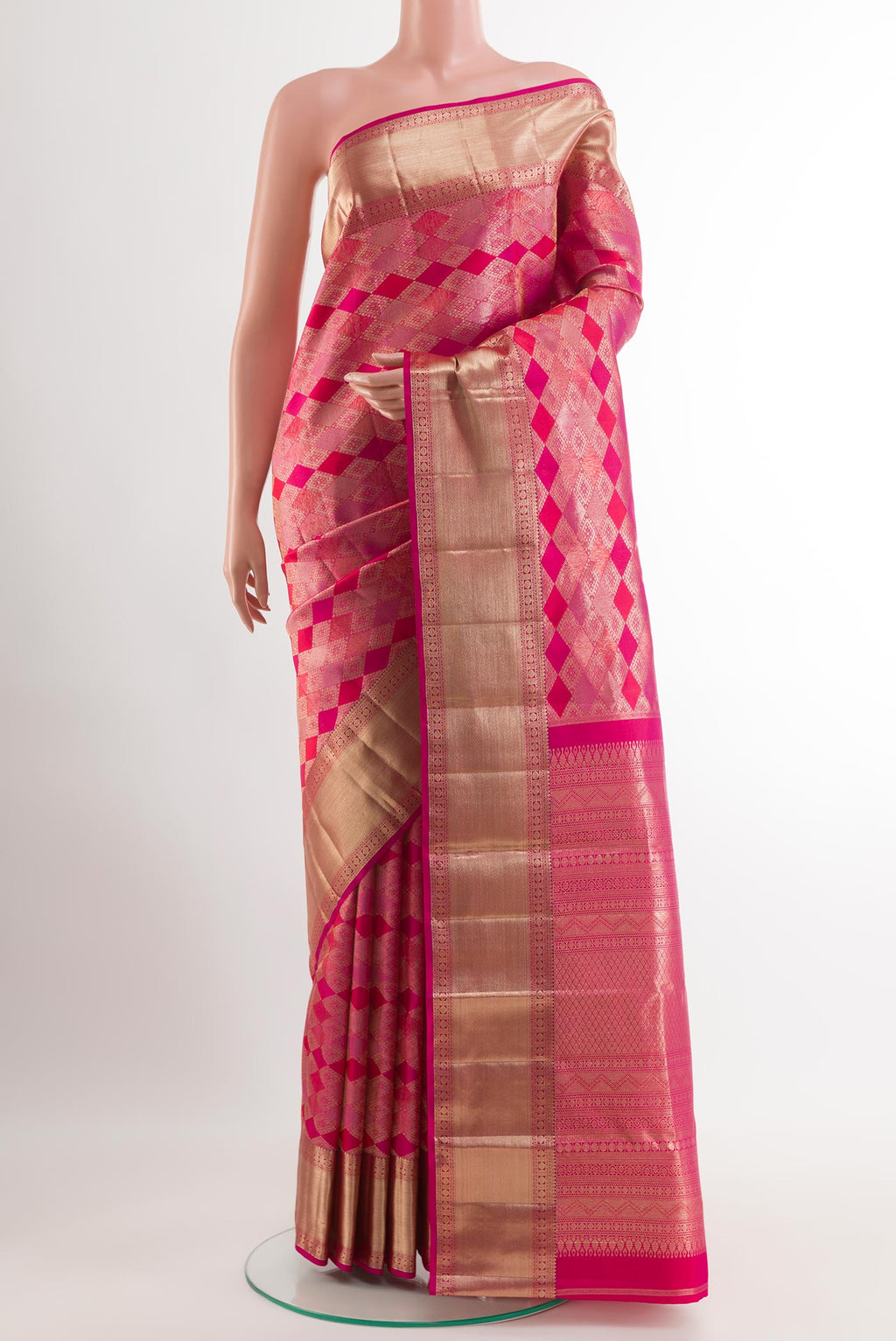 Dark Pink Kanjivaram Silk Saree with Zari Brocade on the body and Zari Border.  displayed on a mannequin