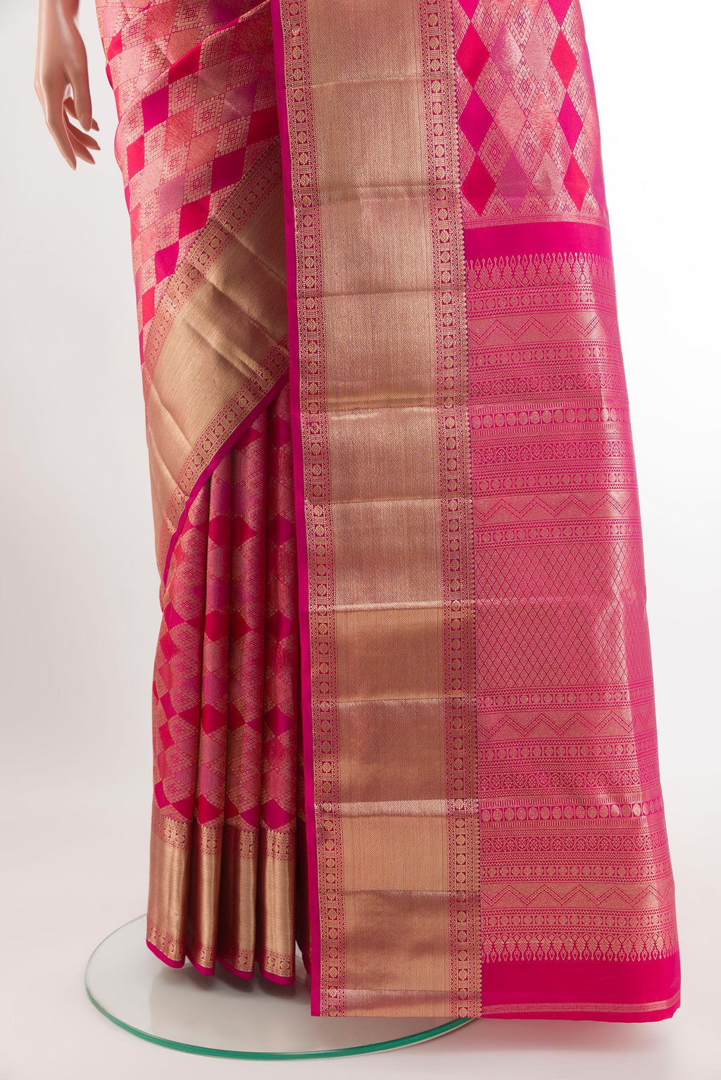 Pleats and pallu of Dark Pink Kanjivaram Silk Saree with Zari Brocade on the body and Zari Border. 