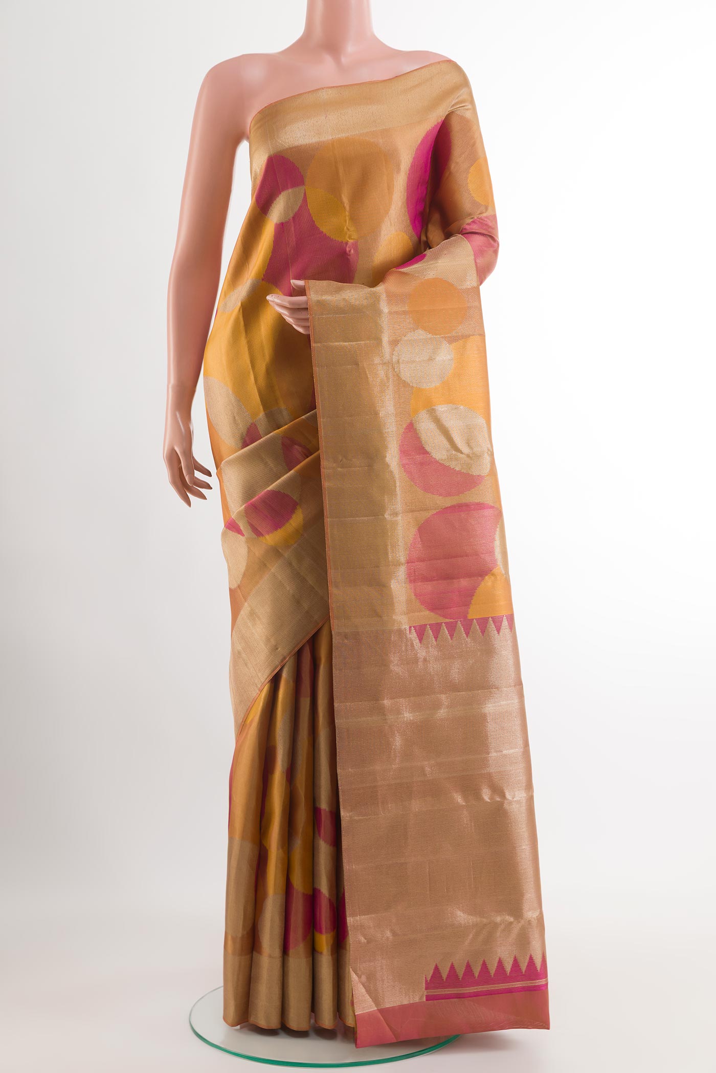 Golden Kanjivaram Silk Saree with Zari Brocade on the body and Zari Border.  displayed on a mannequin