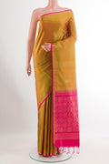 Mustard Soft Silk Saree with Zari Butta on the body and Zari Border.  displayed on a mannequin