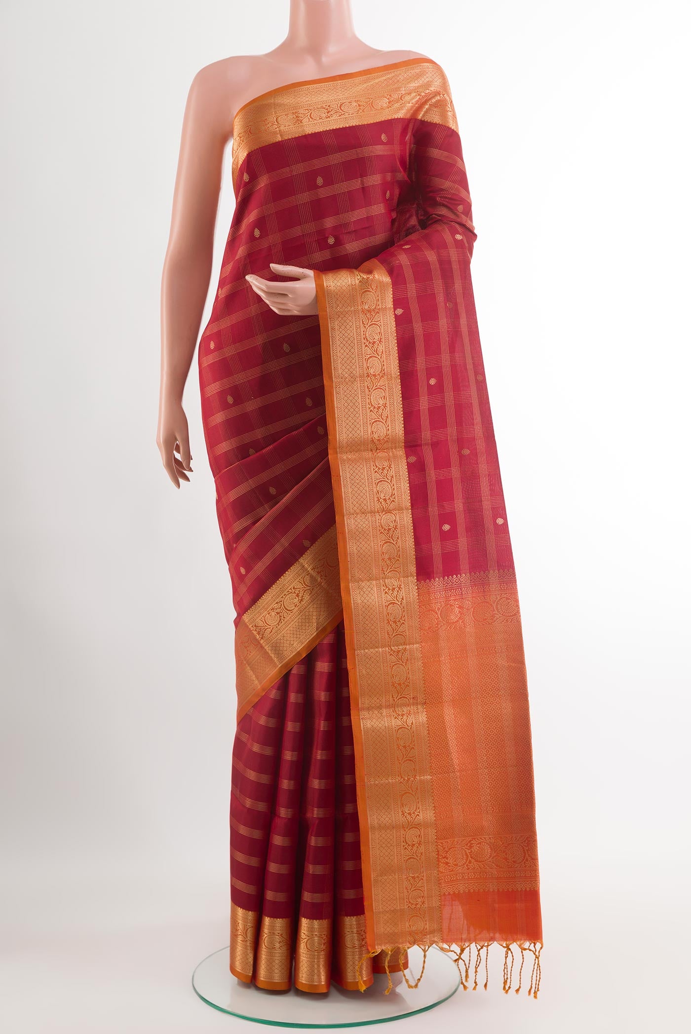 Maroon Soft Silk Saree with Checked design on the body and Zari Border.  displayed on a mannequin