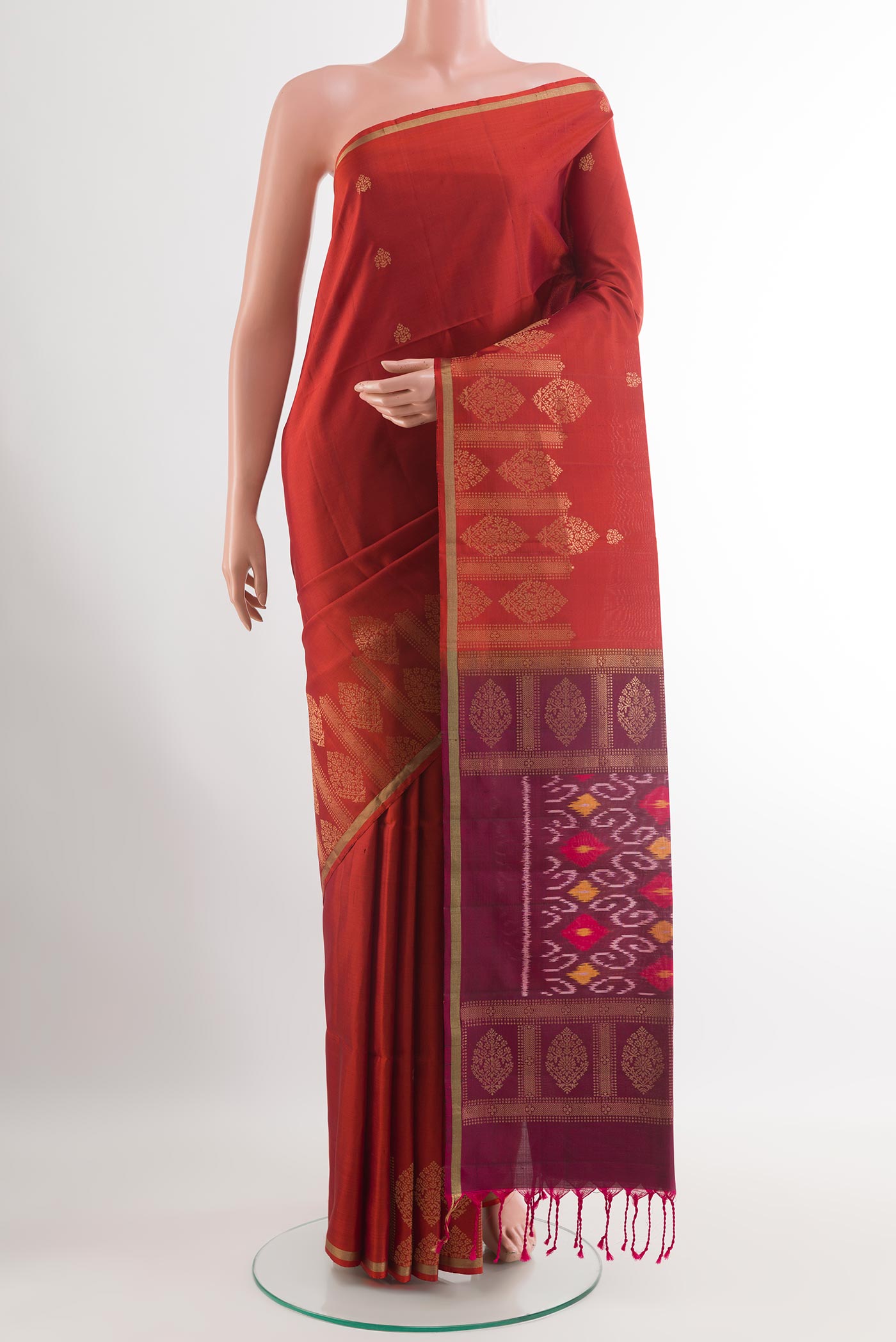 Maroon Soft Silk Saree with Zari Butta on the body and Zari Border.  displayed on a mannequin