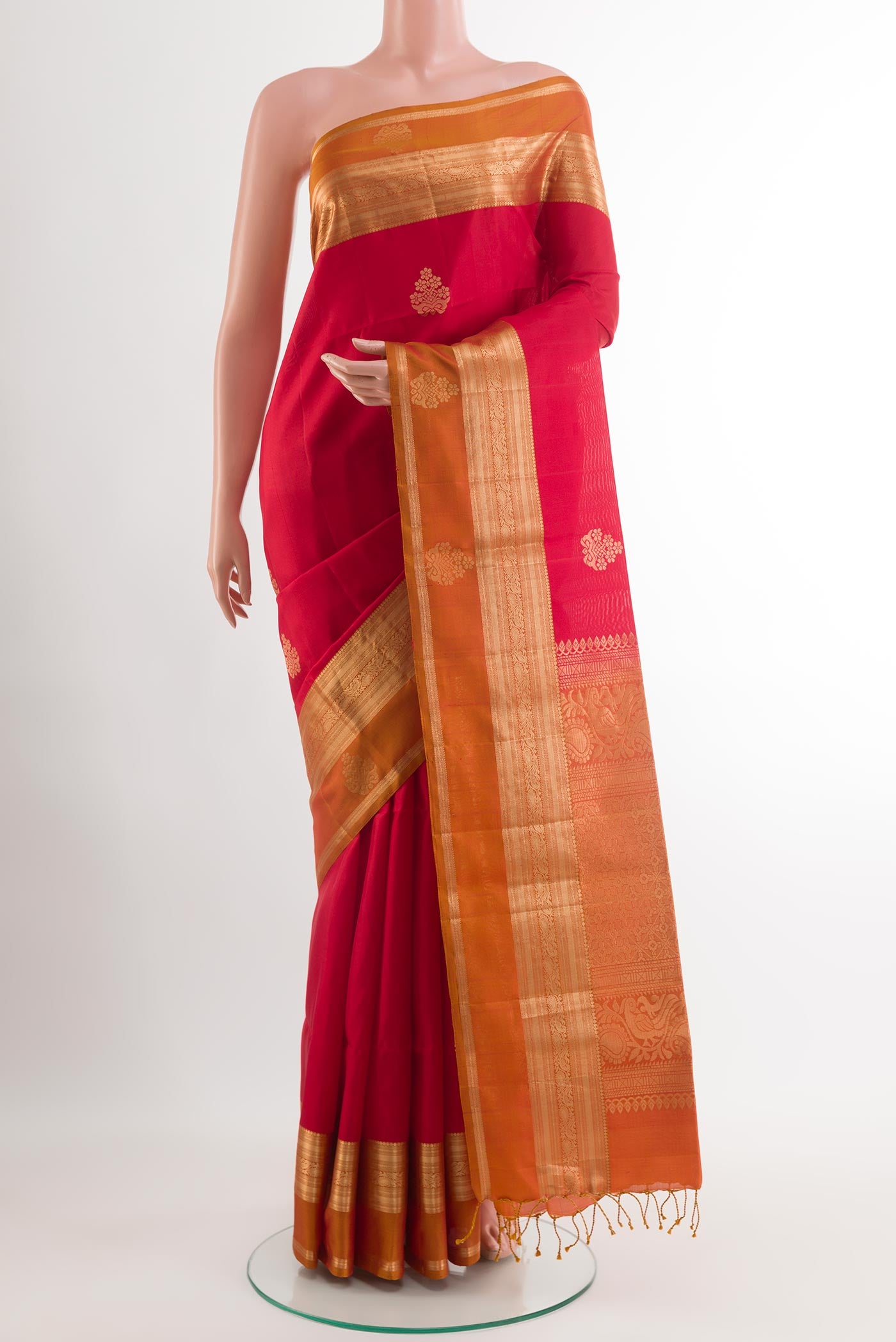 Red Soft Silk Saree with Zari Butta on the body and Zari Border.  displayed on a mannequin