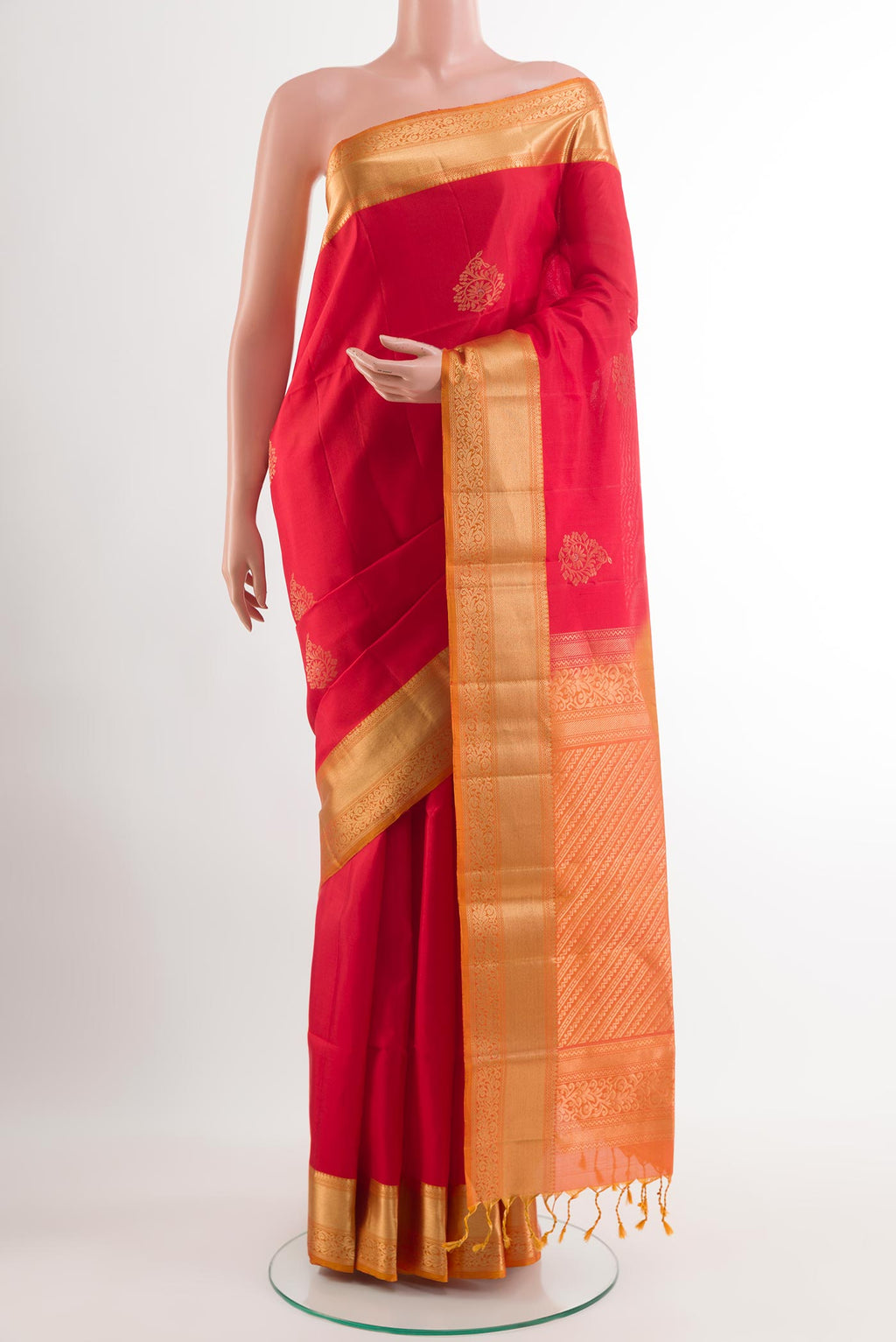 Red Soft Silk Saree with Zari Butta on the body and Zari Border.  displayed on a mannequin