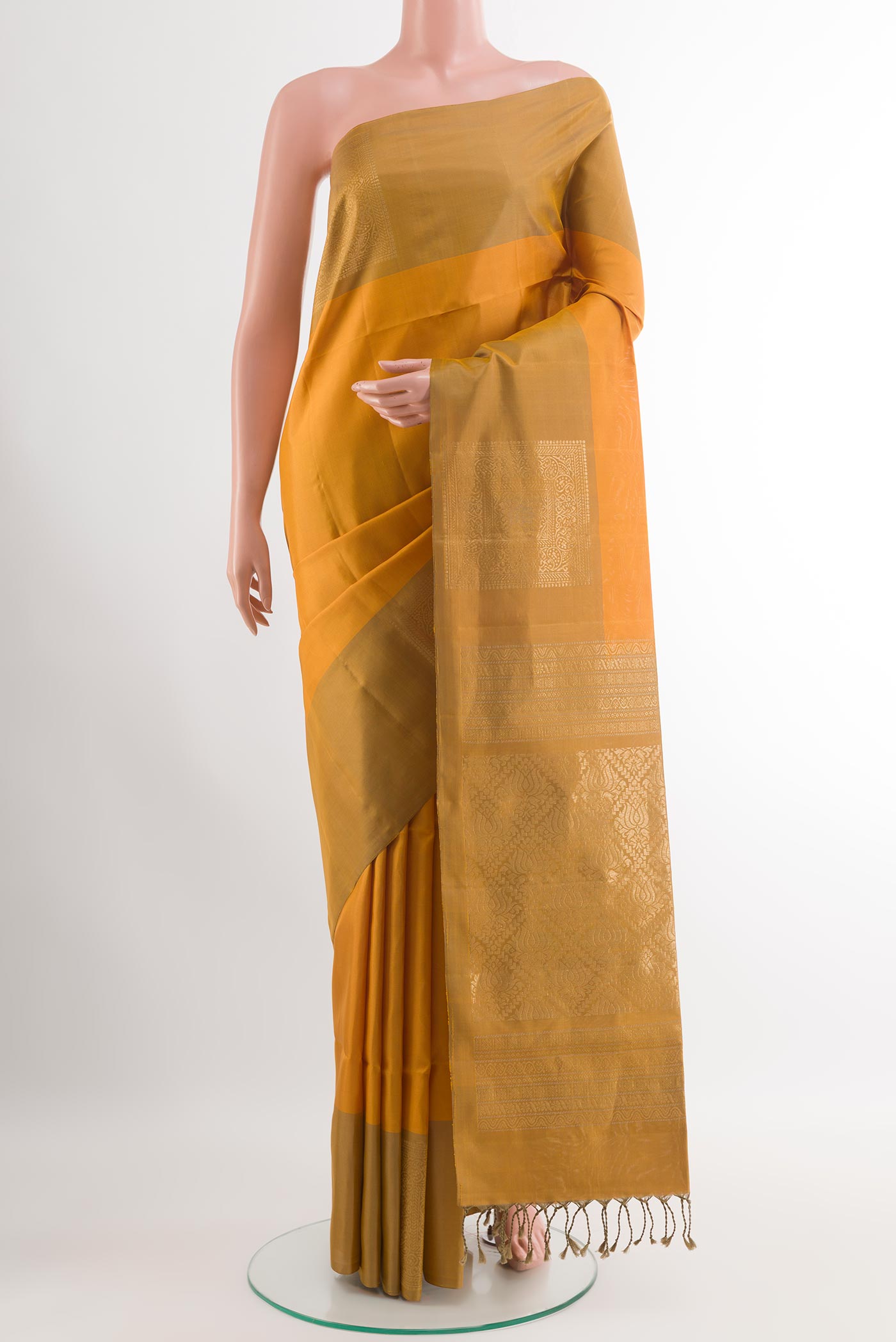 Mustard Soft Silk Saree with Stripes on the body and Zari Border.  displayed on a mannequin
