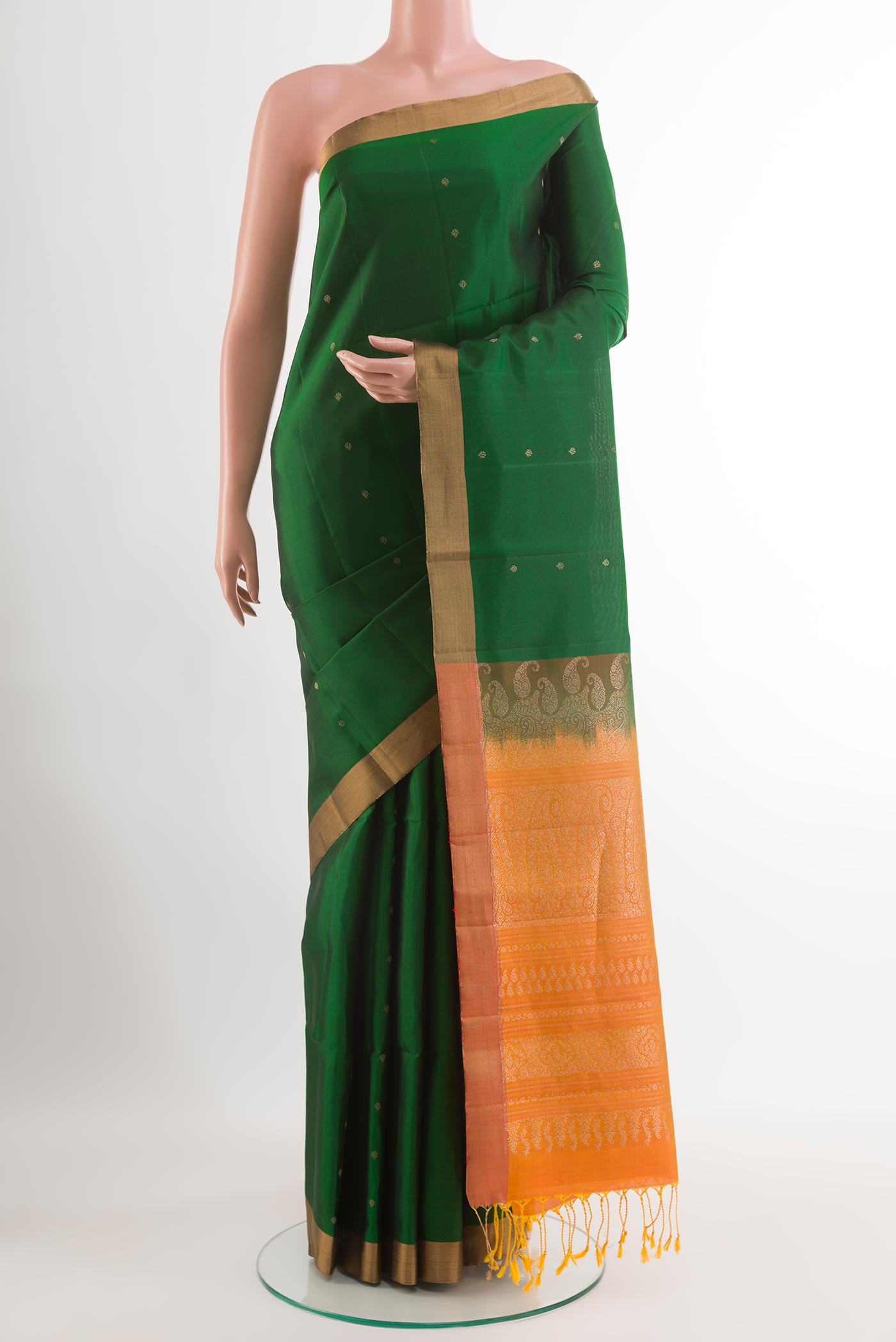 Green Soft Silk Saree with Zari Butta on the body and Zari Border.  displayed on a mannequin