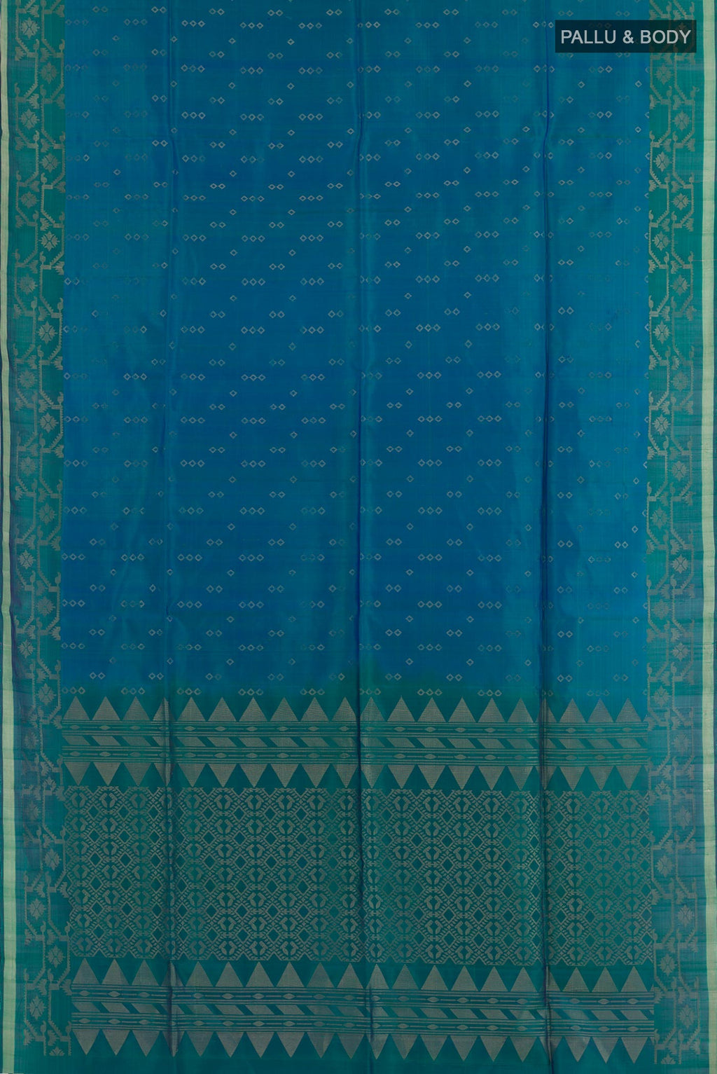 Flat view of Peacock Blue Soft Silk Saree with Zari Butta on the body and Zari Border. 