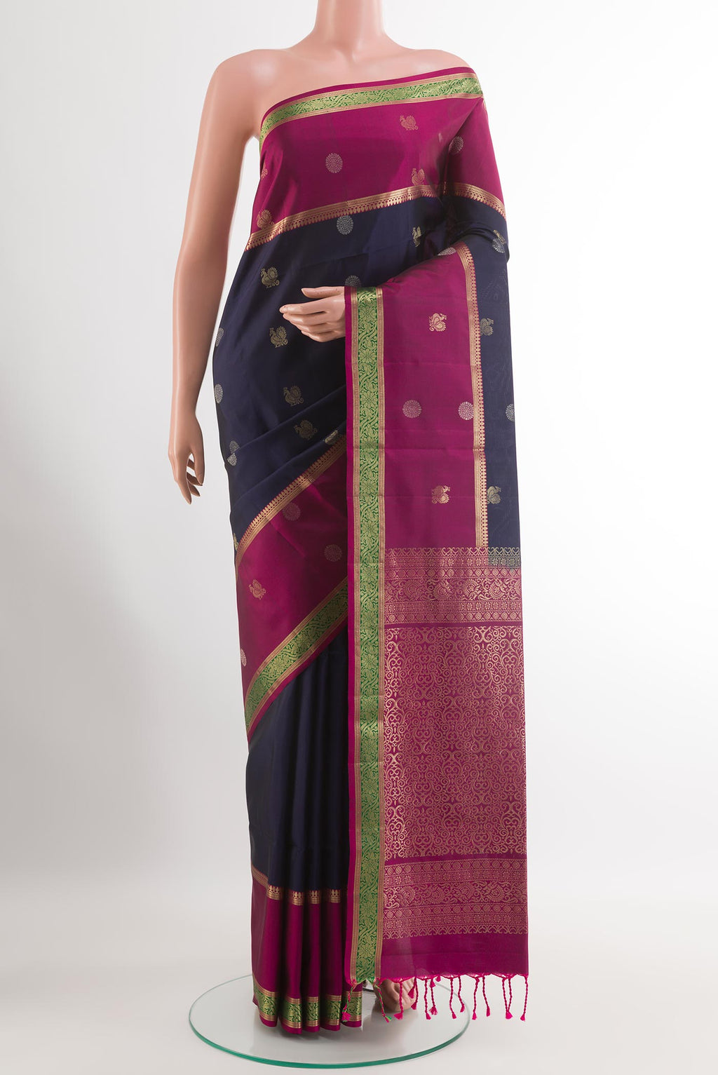 Dark Blue Soft Silk Saree with Zari Butta on the body and Zari Border.  displayed on a mannequin