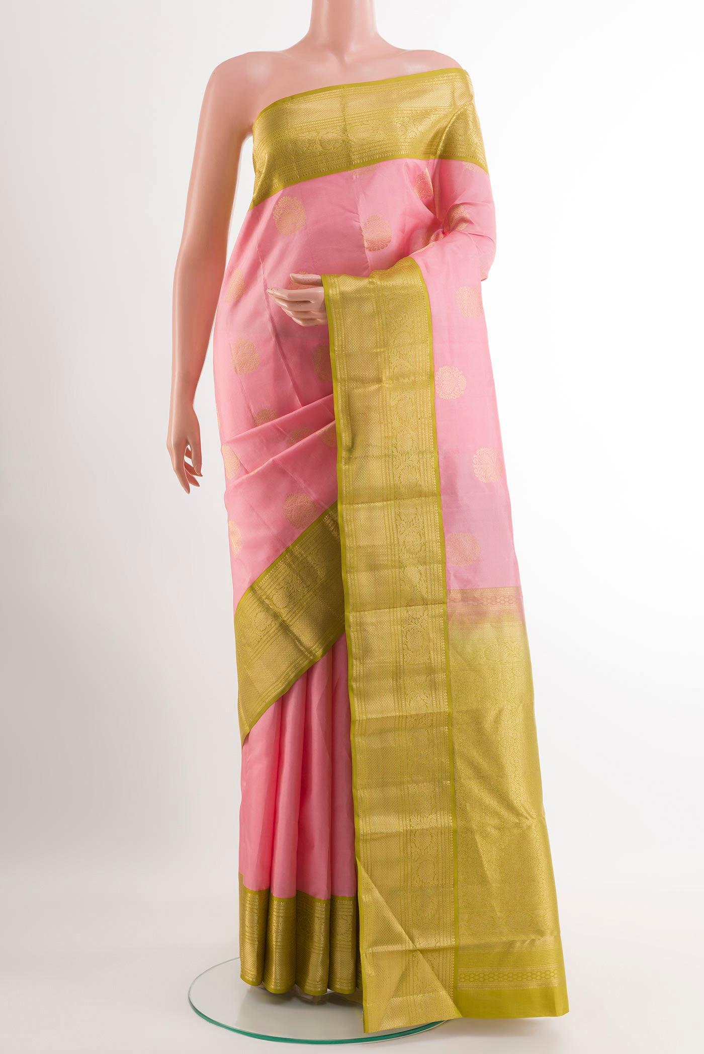 Pink Kanjivaram Silk Saree with Zari Butta on the body and Zari Border.  displayed on a mannequin