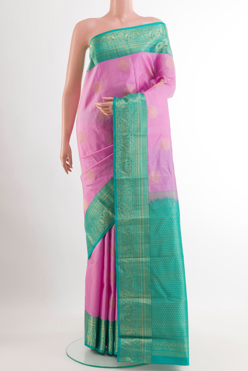 Pink Kanjivaram Silk Saree with Zari Butta on the body and Zari Border.  displayed on a mannequin