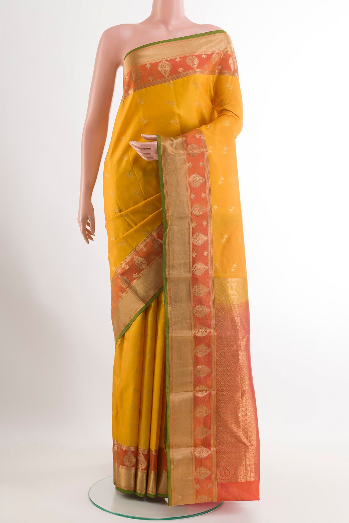 Yellow Kanjivaram Silk Saree with Zari Butta on the body and Zari Border.  displayed on a mannequin