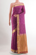 Purple Kanchipuram Silk Saree with Jacquard design on the body and Zari Border.  displayed on a mannequin