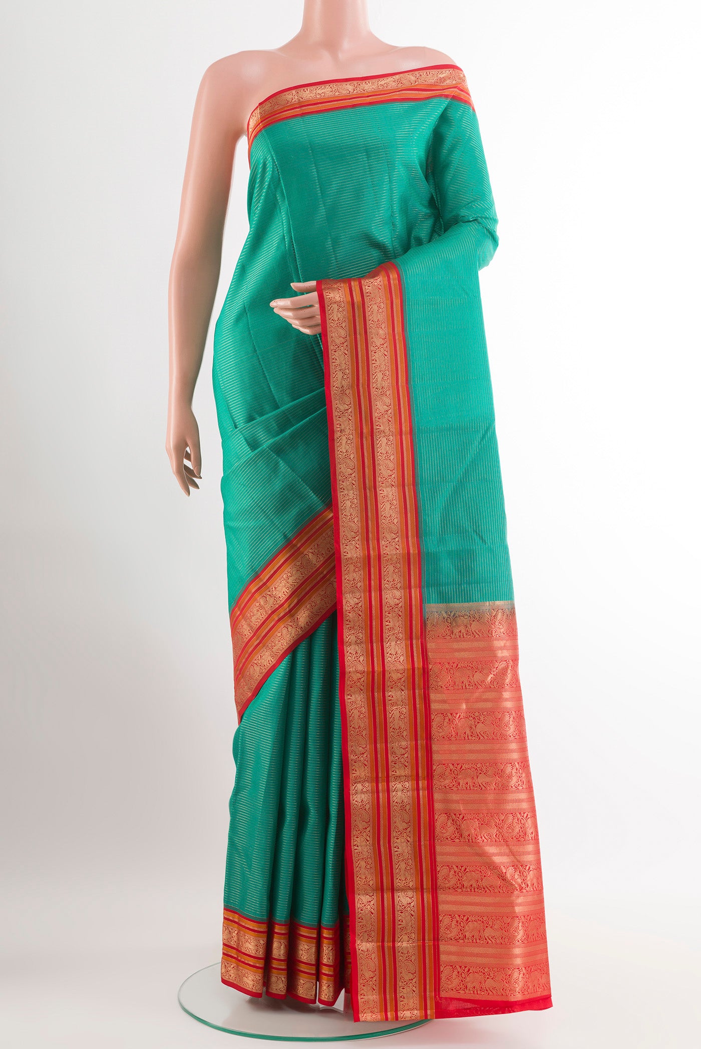 Sea Green Kanjivaram Silk Saree with Stripes on the body and Zari Border.  displayed on a mannequin