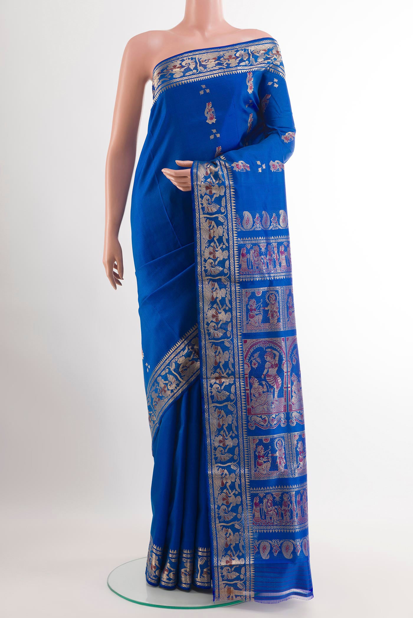 Blue Baluchari Silk Saree with Zari Butta on the body and Zari Border.  displayed on a mannequin