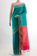 Blue Raw Silk Saree with Zari Butta on the body and Zari Border.  displayed on a mannequin