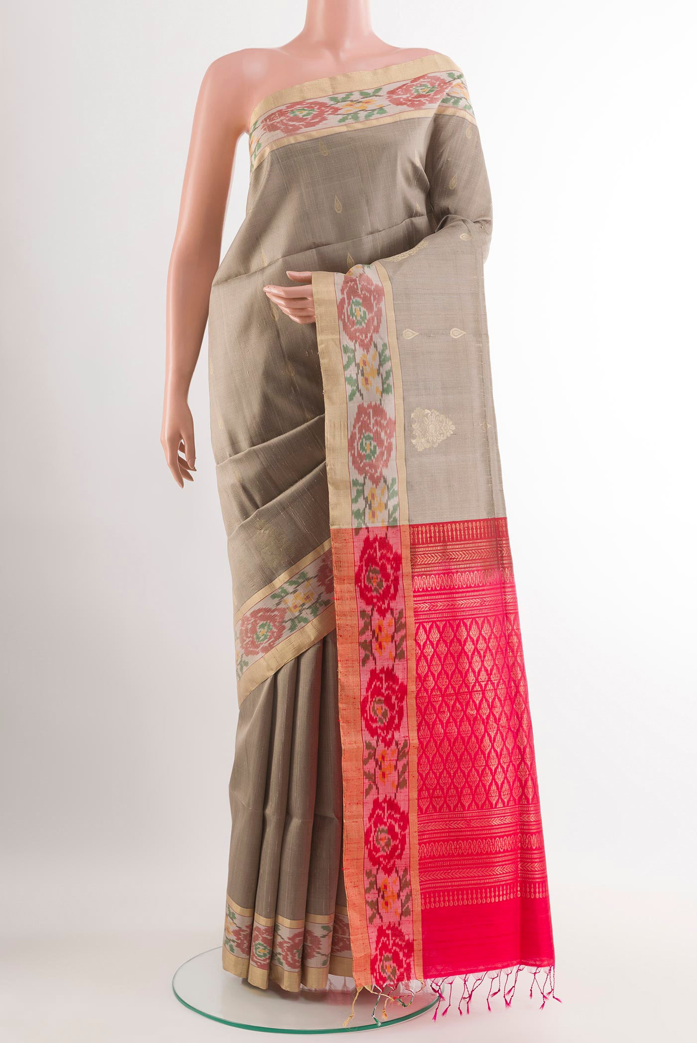 Grey Soft Silk Saree with Zari Butta on the body and Zari Border.  displayed on a mannequin