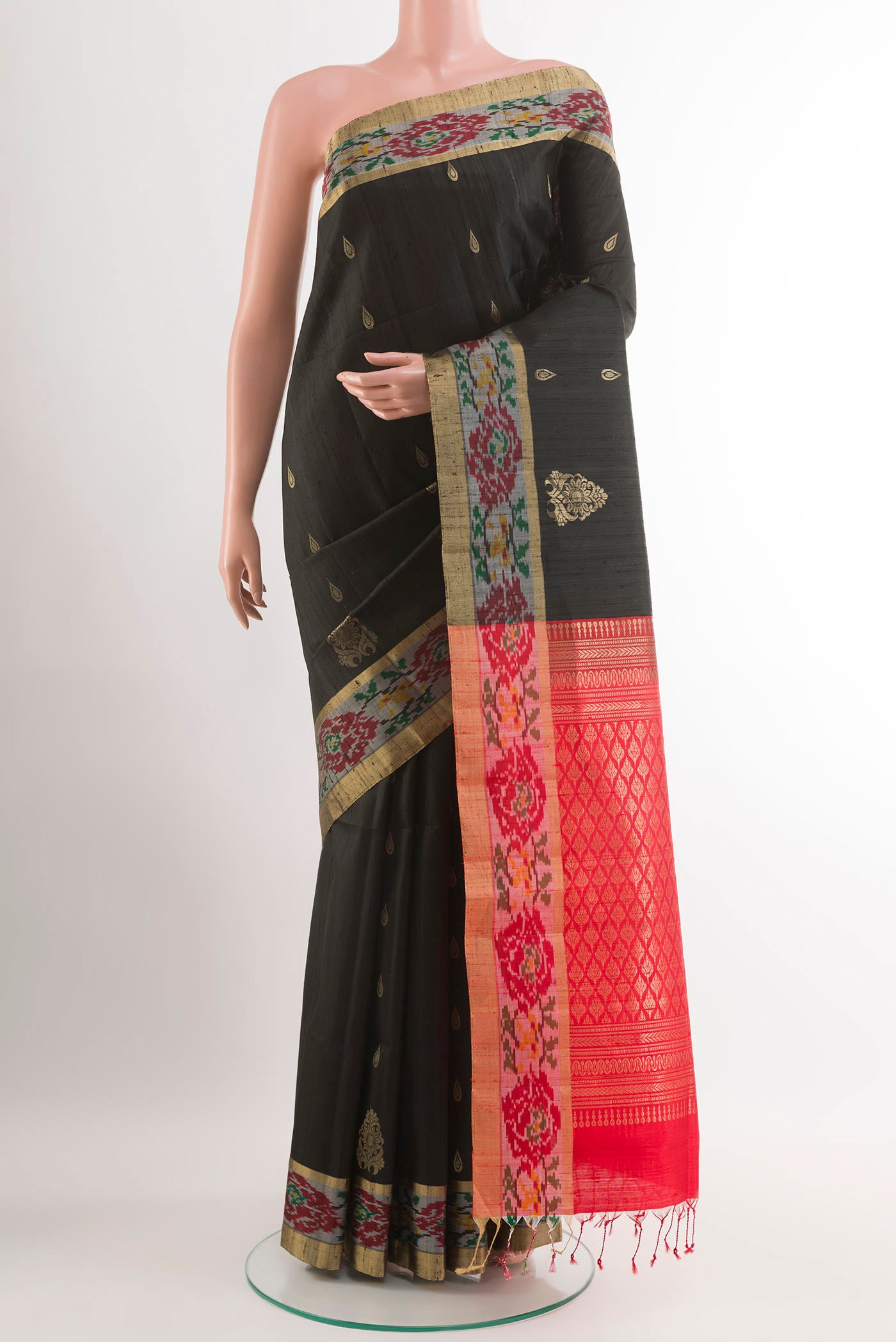 Black Soft Silk Saree with Zari Butta on the body and Zari Border.  displayed on a mannequin