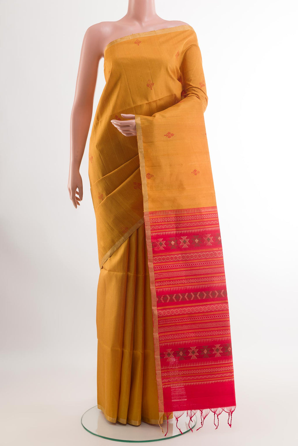 Yellow Raw Silk Saree with Thread Butta on the body and Zari Border.  displayed on a mannequin