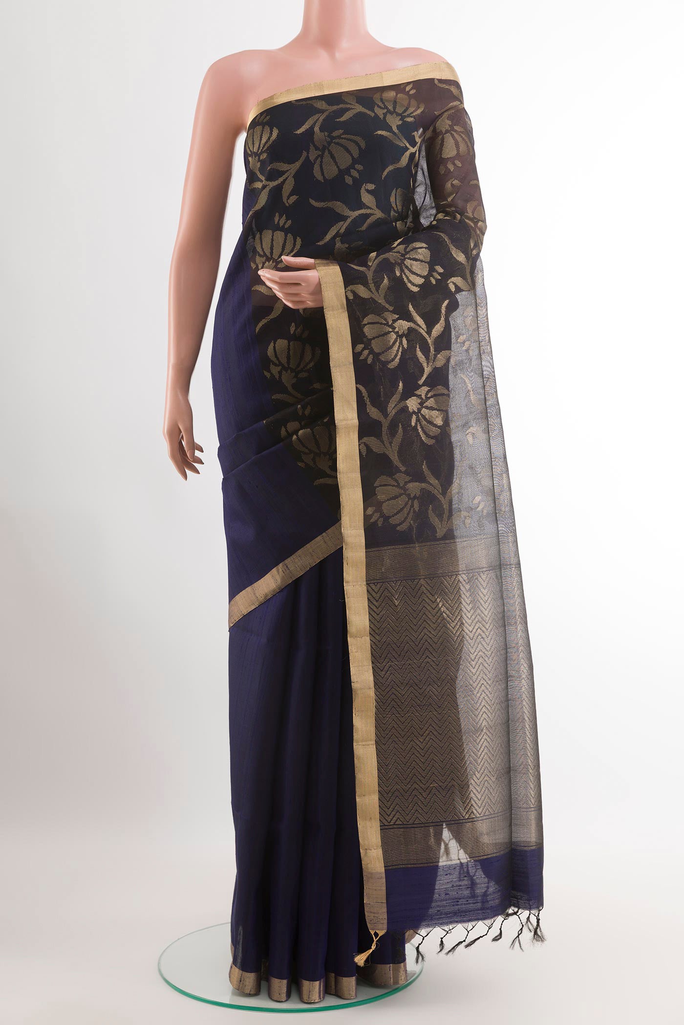 Dark Blue Raw Silk Saree with Plain Body and Zari Border.  displayed on a mannequin
