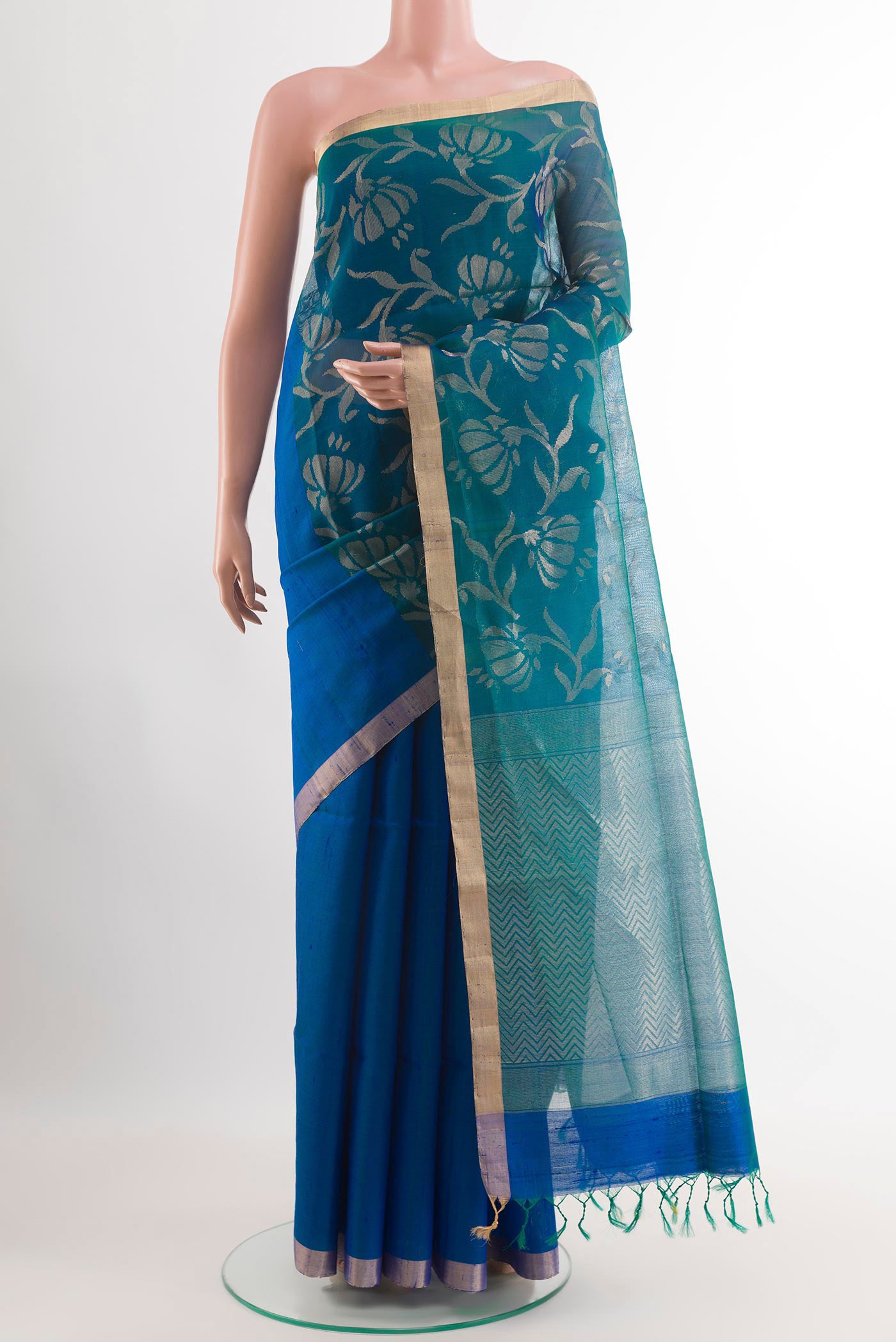 Blue Raw Silk Saree with Plain Body and Zari Border.  displayed on a mannequin