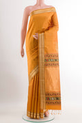 Yellow Soft Silk Saree with Zari Butta on the body and Zari Border.  displayed on a mannequin