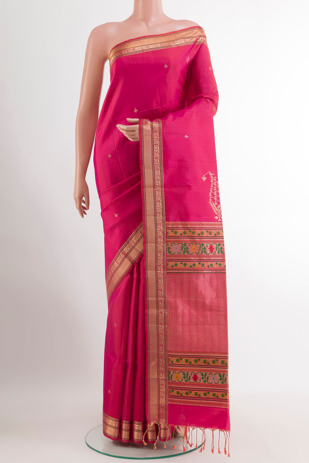 Pink Soft Silk Saree with Zari Butta on the body and Zari Border.  displayed on a mannequin
