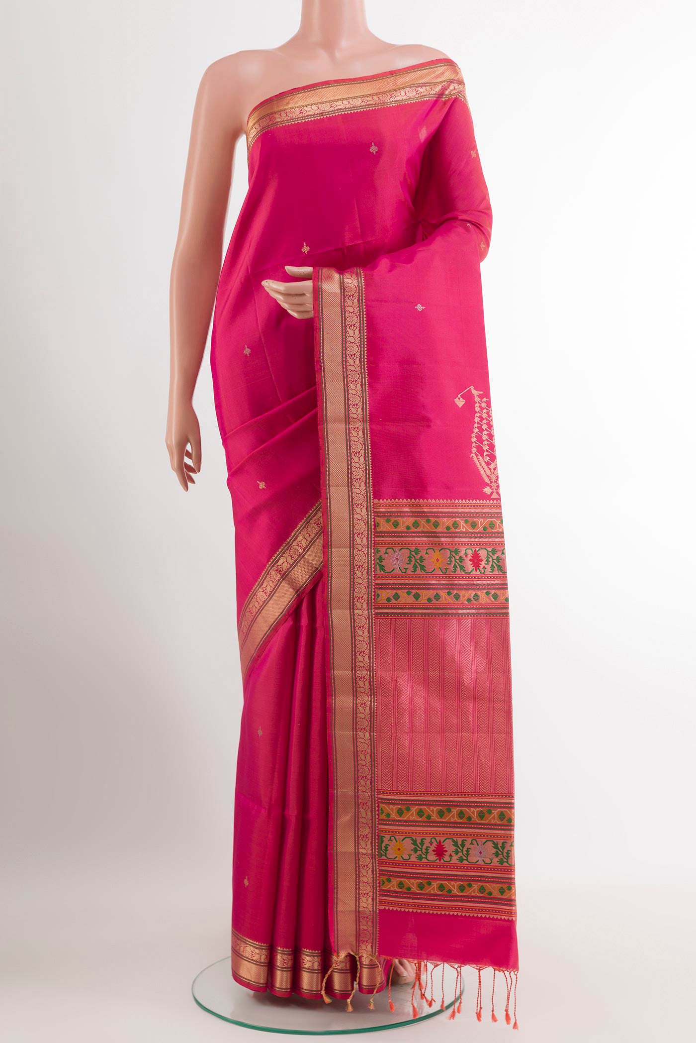 Pink Soft Silk Saree with Zari Butta on the body and Zari Border.  displayed on a mannequin
