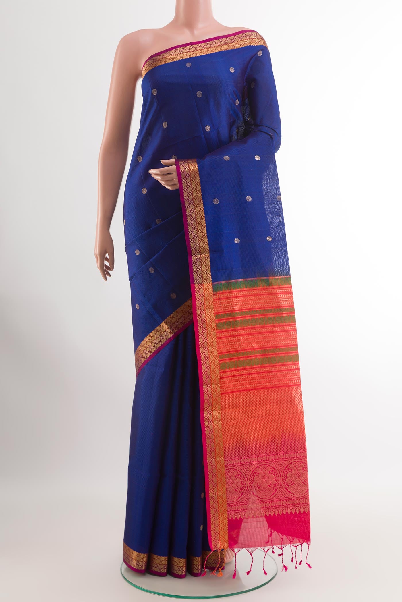 Blue Soft Silk Saree with Zari Butta on the body and Zari Border.  displayed on a mannequin