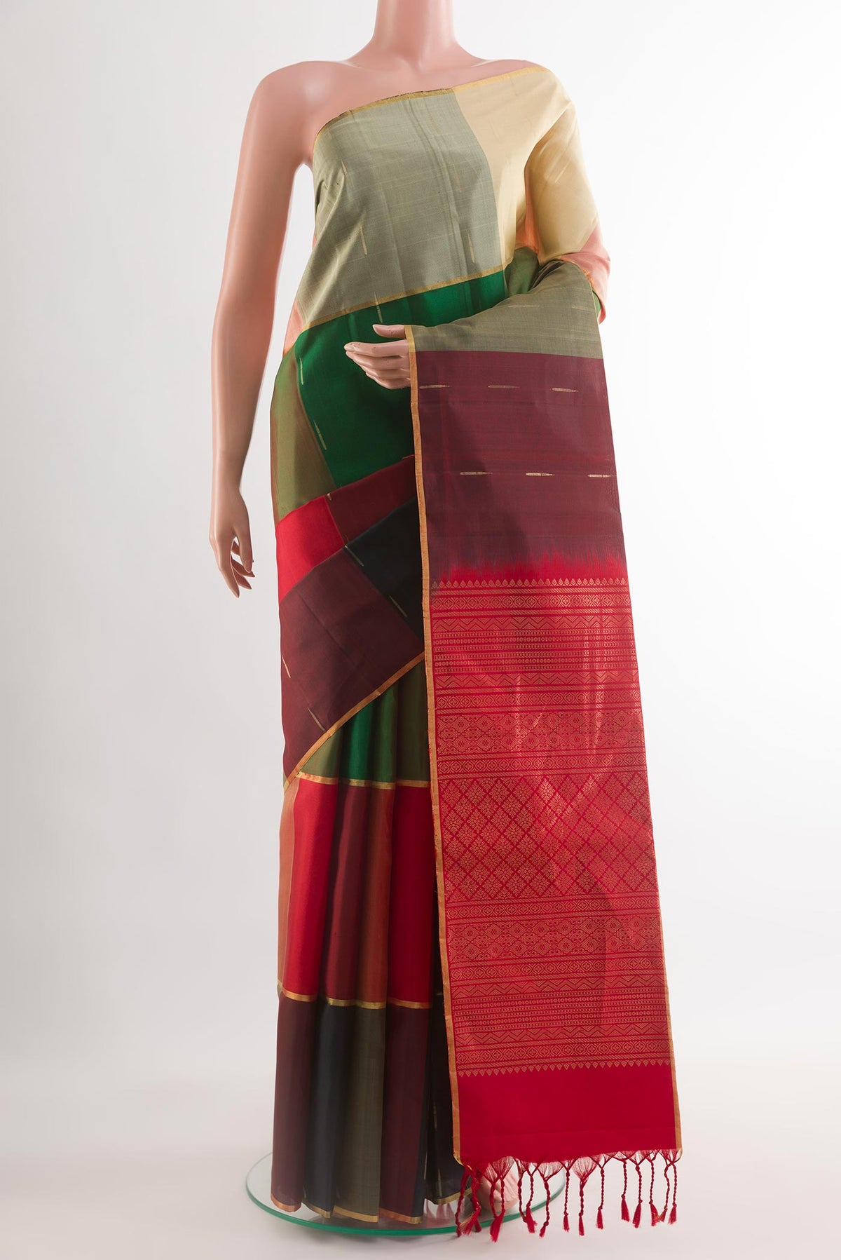 Multi Color Soft Silk Saree with Zari Butta on the body and Zari Border.  displayed on a mannequin