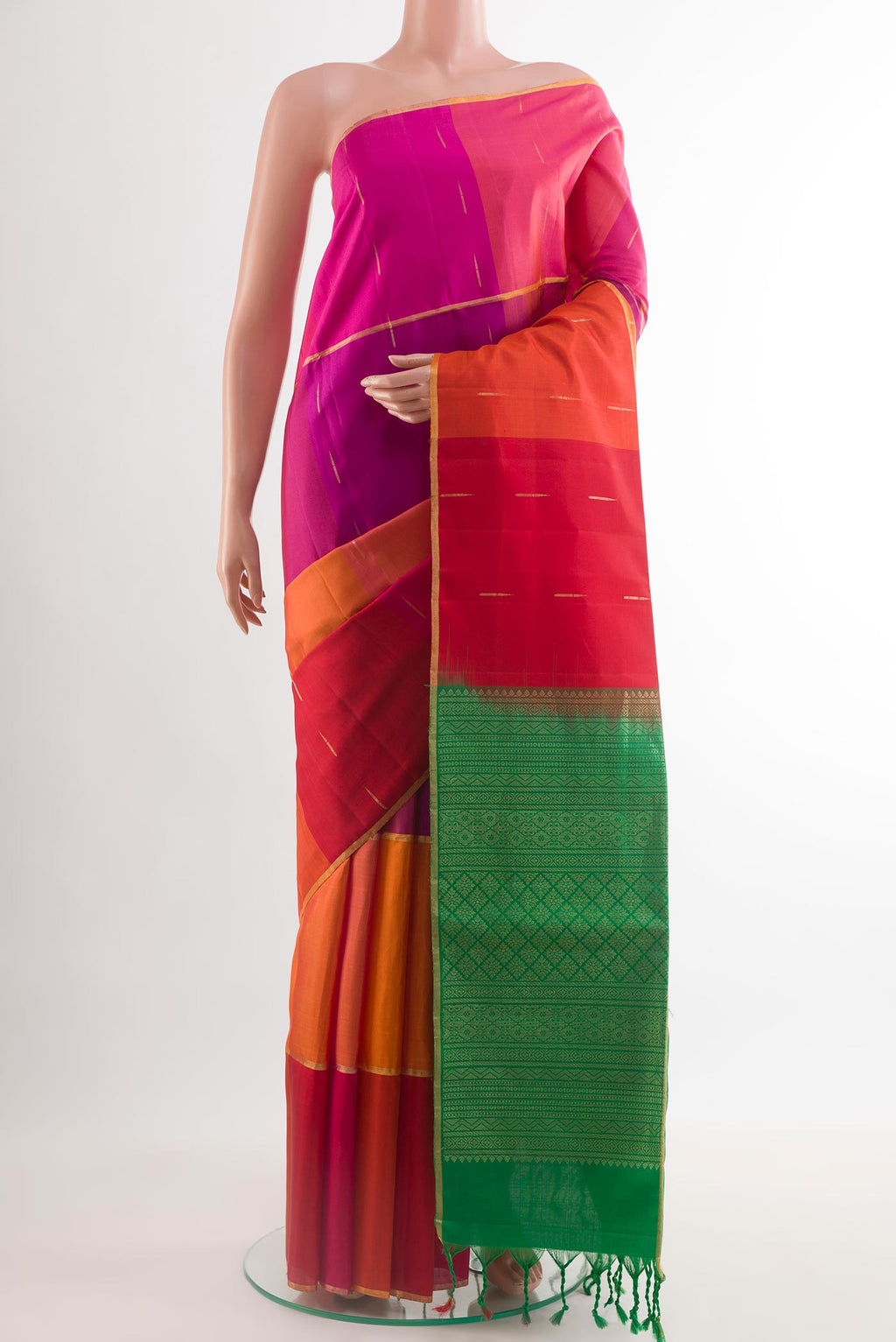 Multi Color Soft Silk Saree with Zari Butta on the body and Zari Border.  displayed on a mannequin