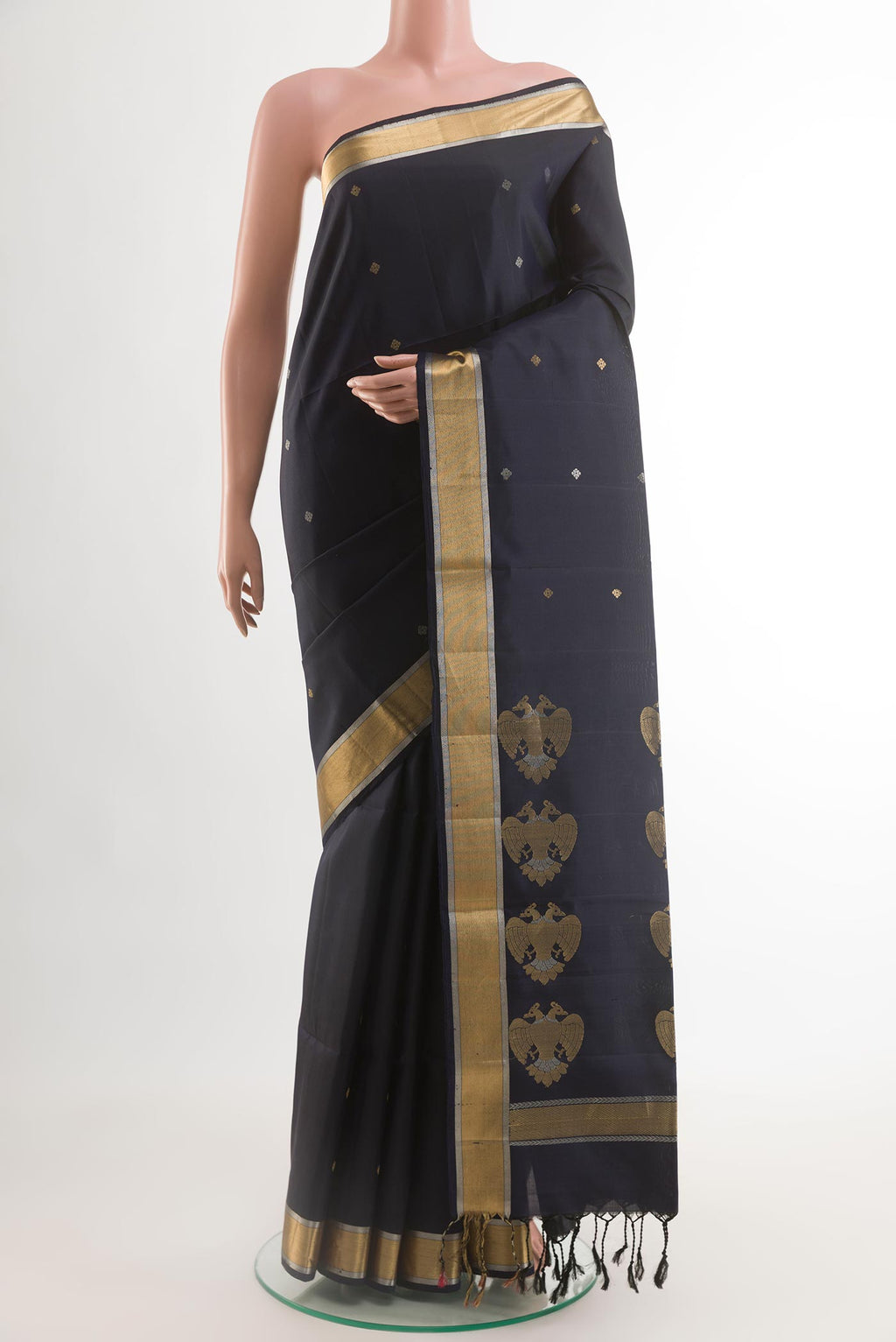 Dark Blue Soft Silk Saree with Zari Butta on the body and Zari Border.  displayed on a mannequin