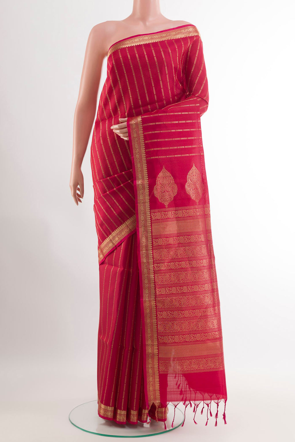 Pink Soft Silk Saree with Zari Butta on the body and Zari Border.  displayed on a mannequin