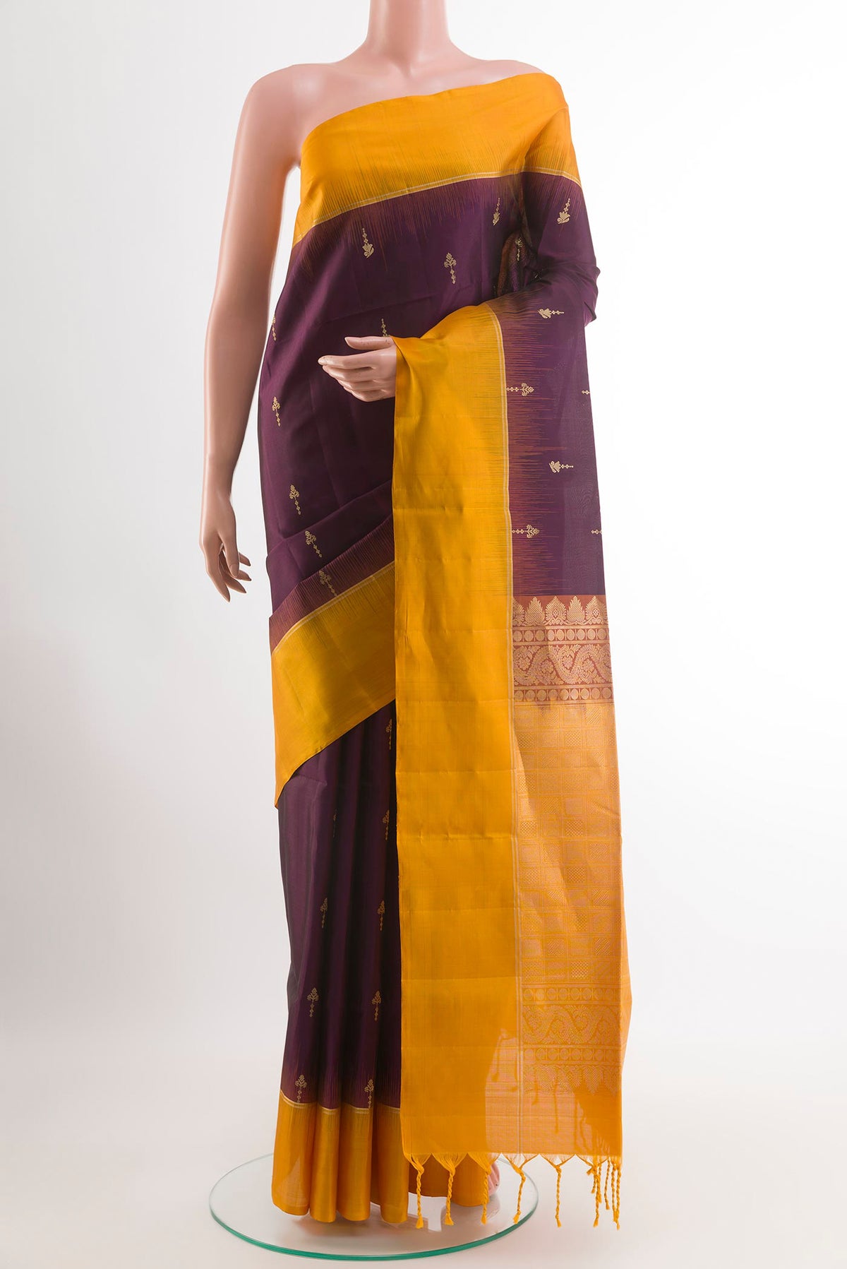 Purple Soft Silk Saree with Zari Butta on the body and Zari Border.  displayed on a mannequin