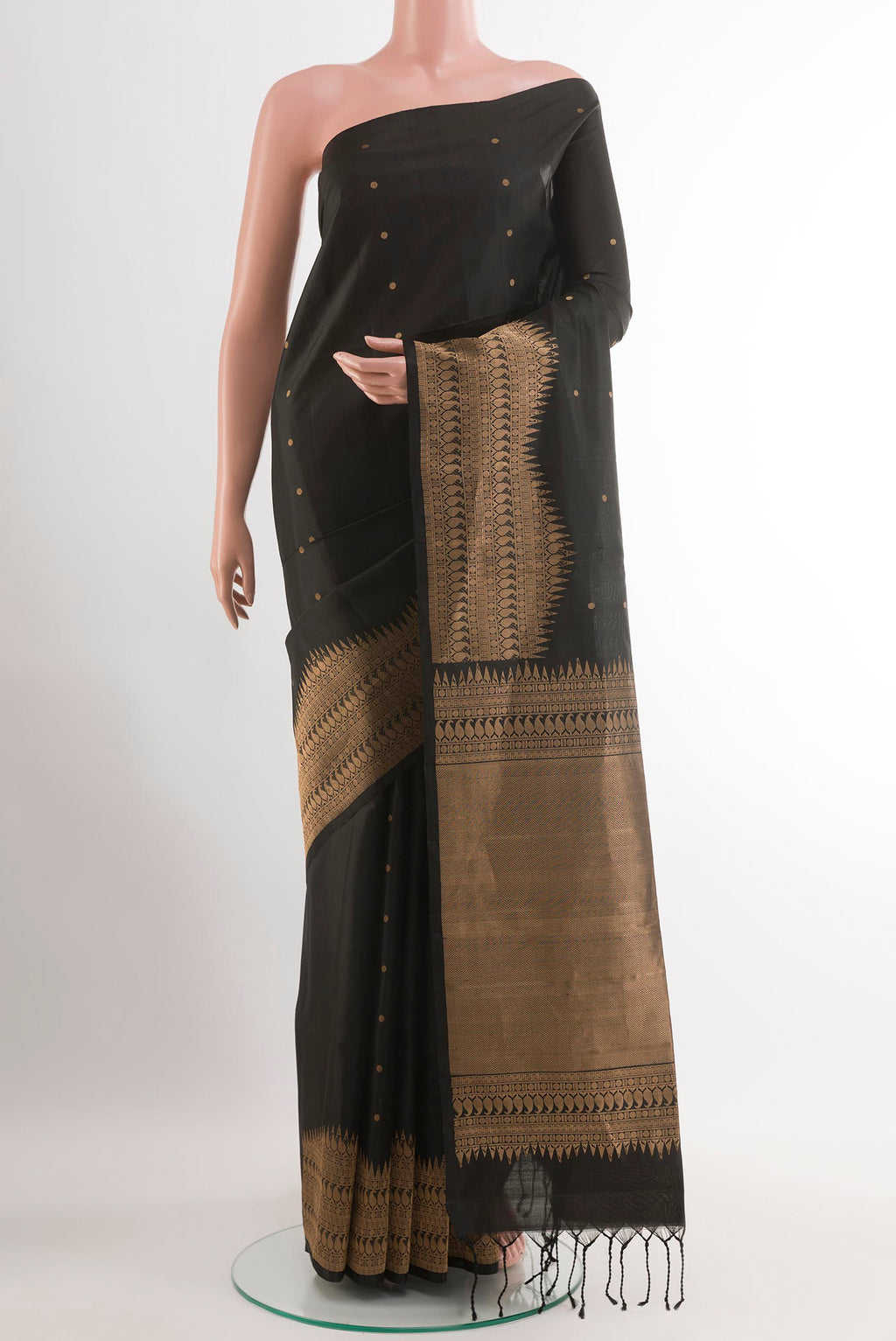 Black Soft Silk Saree with Zari Butta on the body and Zari Border.  displayed on a mannequin