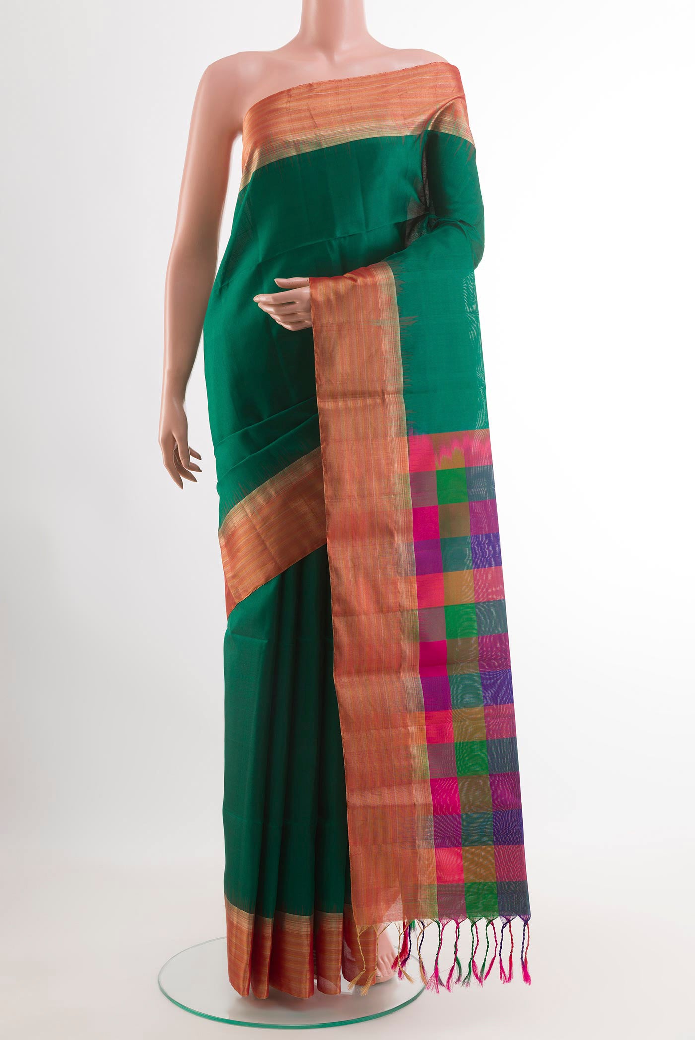 Green Soft Silk Saree with Plain Body and Zari Border.  displayed on a mannequin