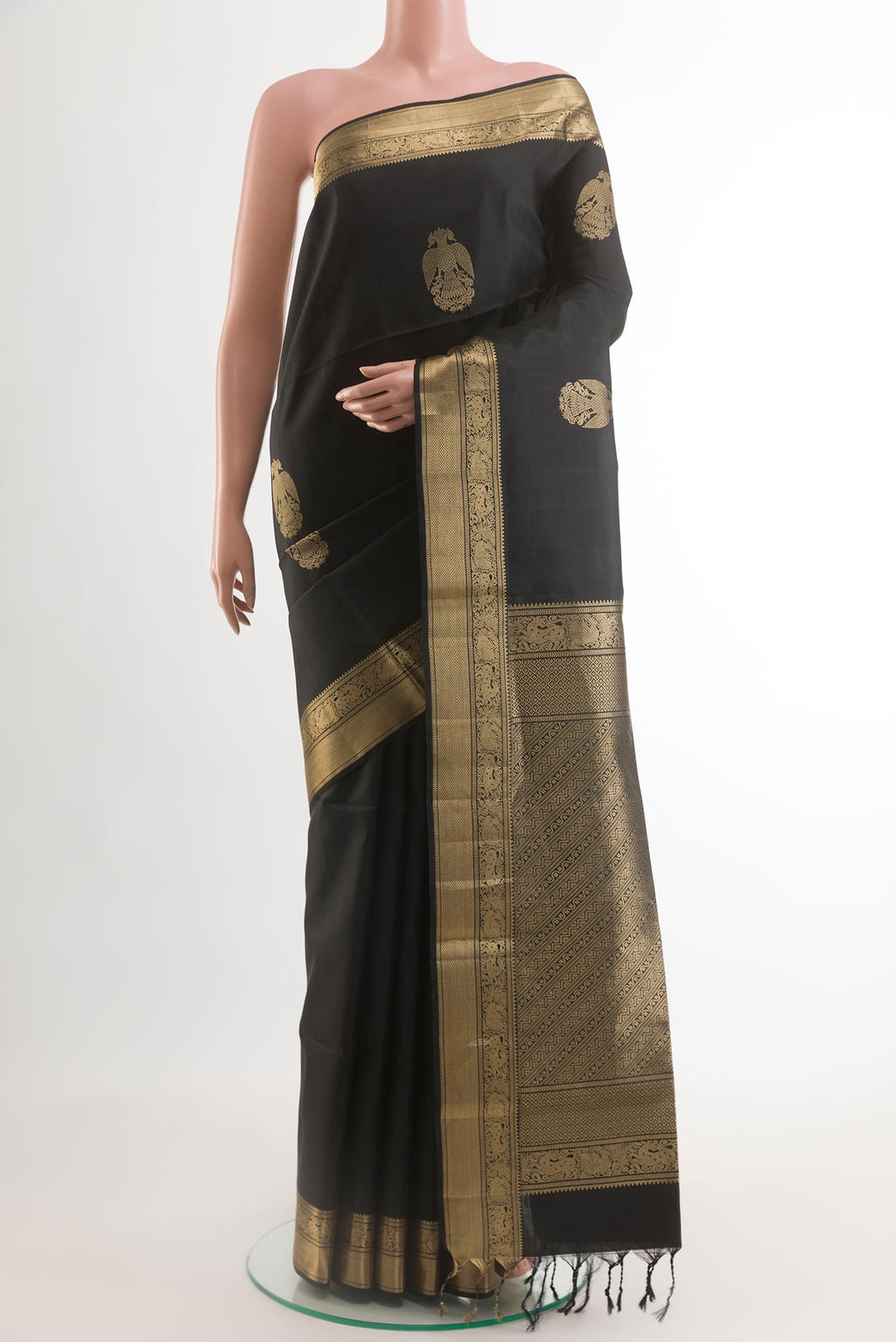 Black Soft Silk Saree with Checked design on the body and Zari Border.  displayed on a mannequin