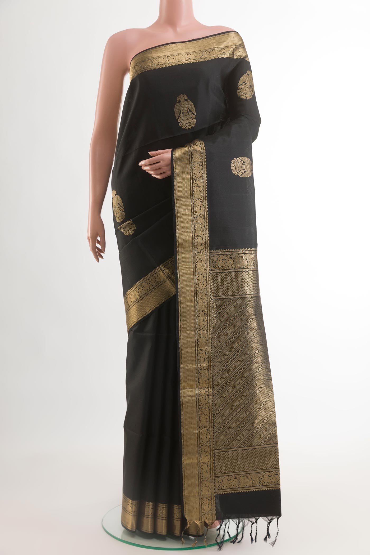 Black Soft Silk Saree with Checked design on the body and Zari Border.  displayed on a mannequin