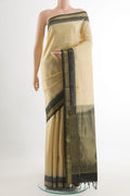 Beige Soft Silk Saree with Zari Butta on the body and Zari Border.  displayed on a mannequin