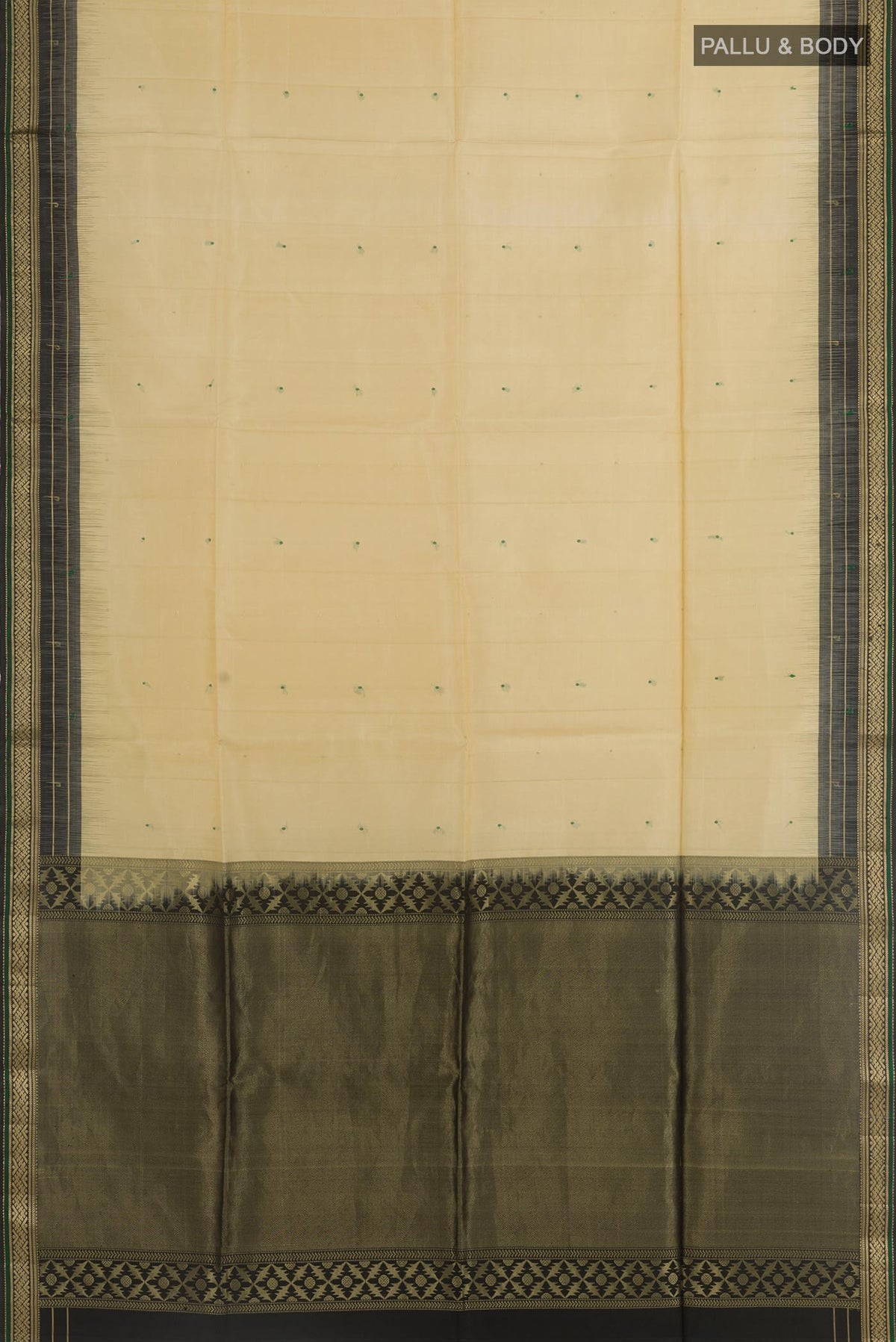 Flat view of Beige Soft Silk Saree with Zari Butta on the body and Zari Border. 