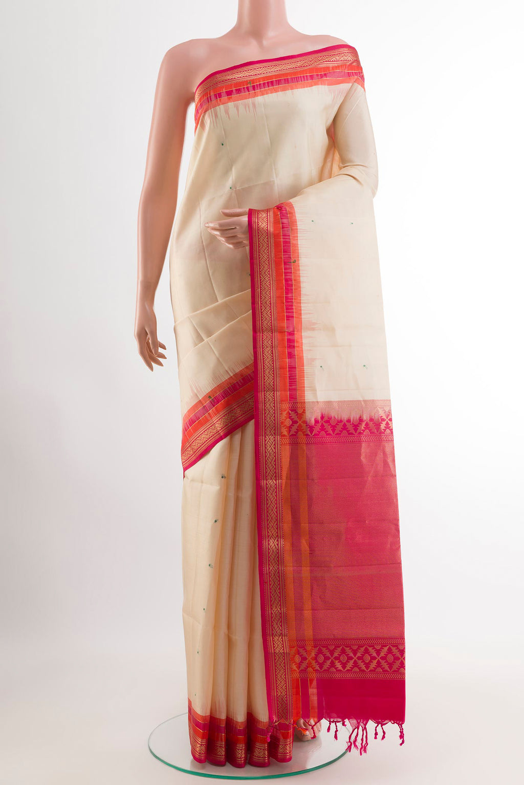 Off White Soft Silk Saree with Zari Butta on the body and Zari Border.  displayed on a mannequin