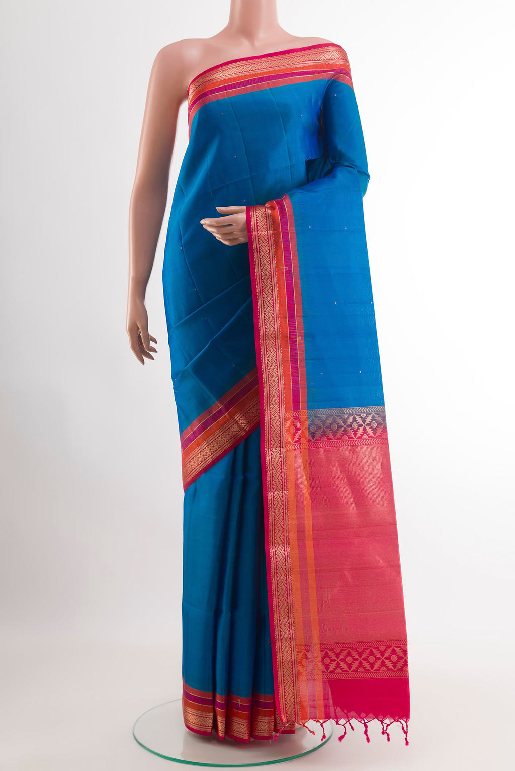 Blue Soft Silk Saree with Zari Butta on the body and Zari Border.  displayed on a mannequin