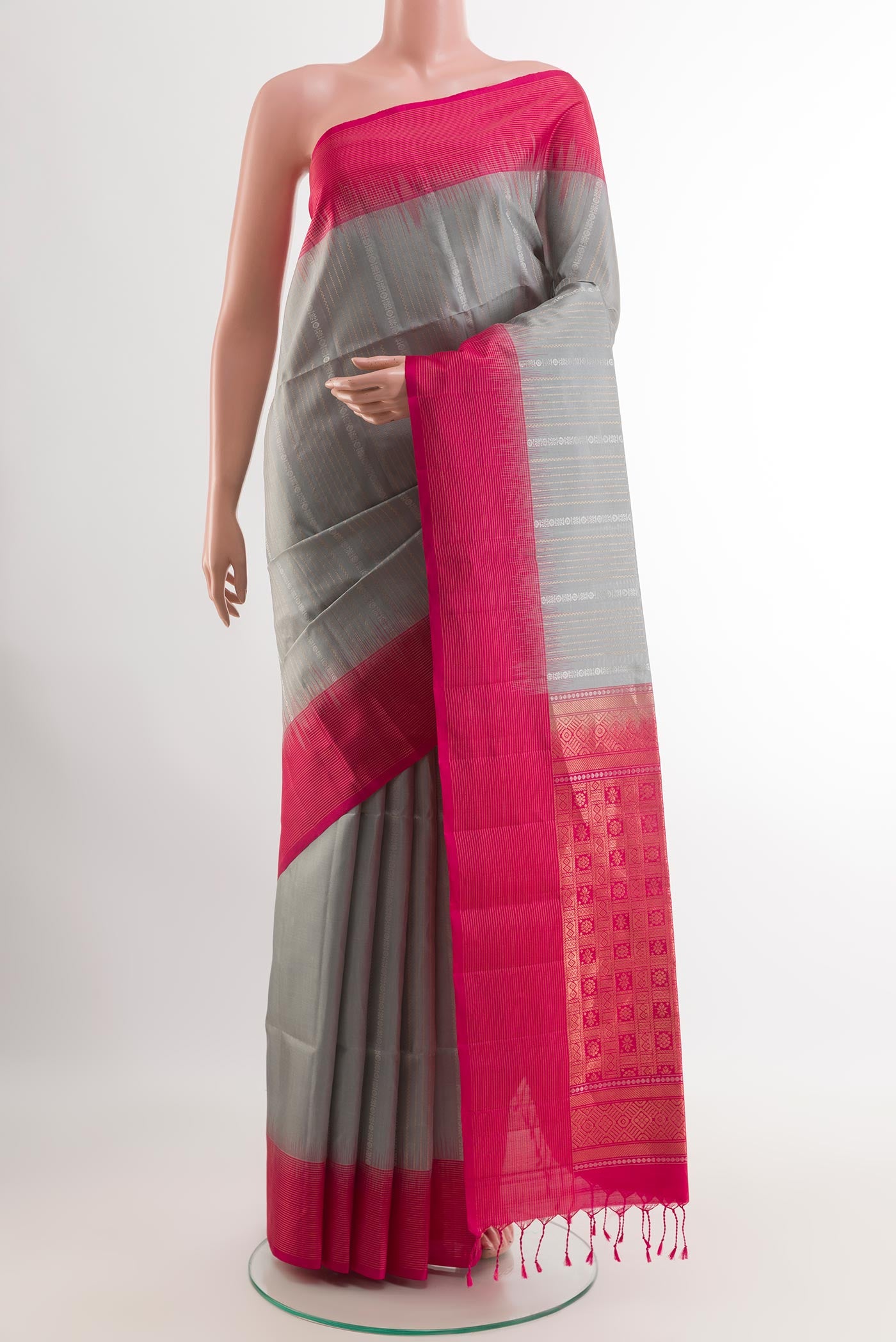 Grey Soft Silk Saree with Stripes on the body and Zari Border.  displayed on a mannequin