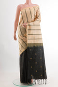 Cream Soft Silk Saree with Stripes on the body and Zari Border.  displayed on a mannequin