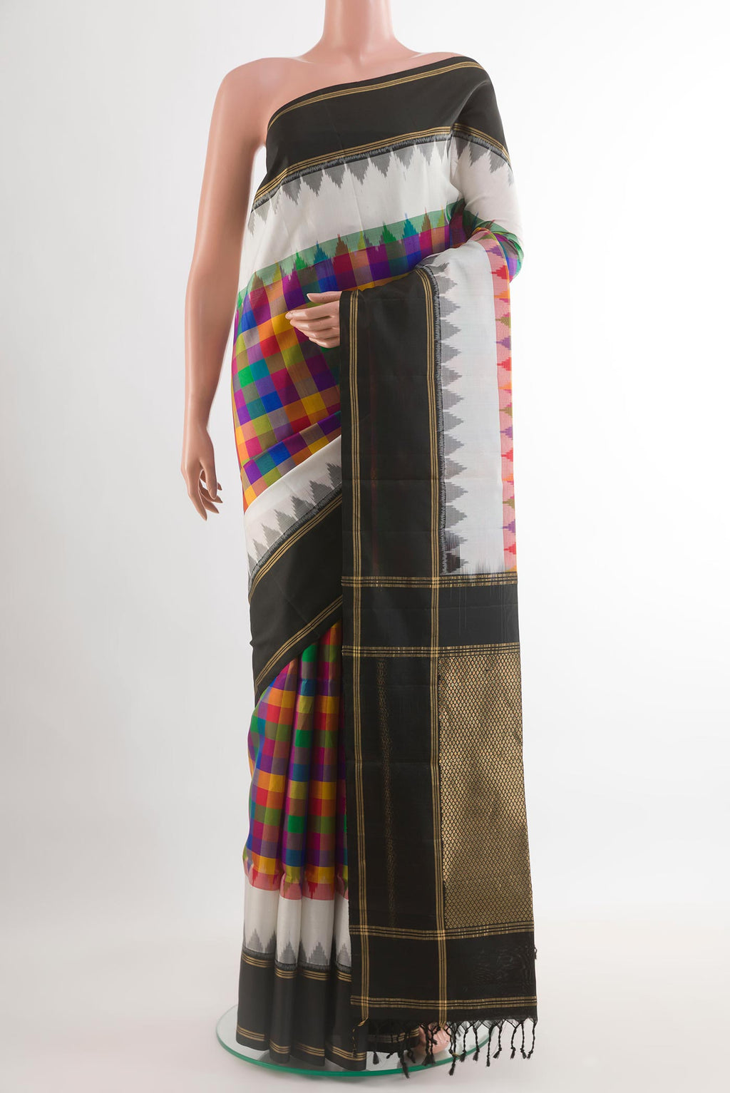 Multi Color Soft Silk Saree with Checked design on the body and Zari Border.  displayed on a mannequin