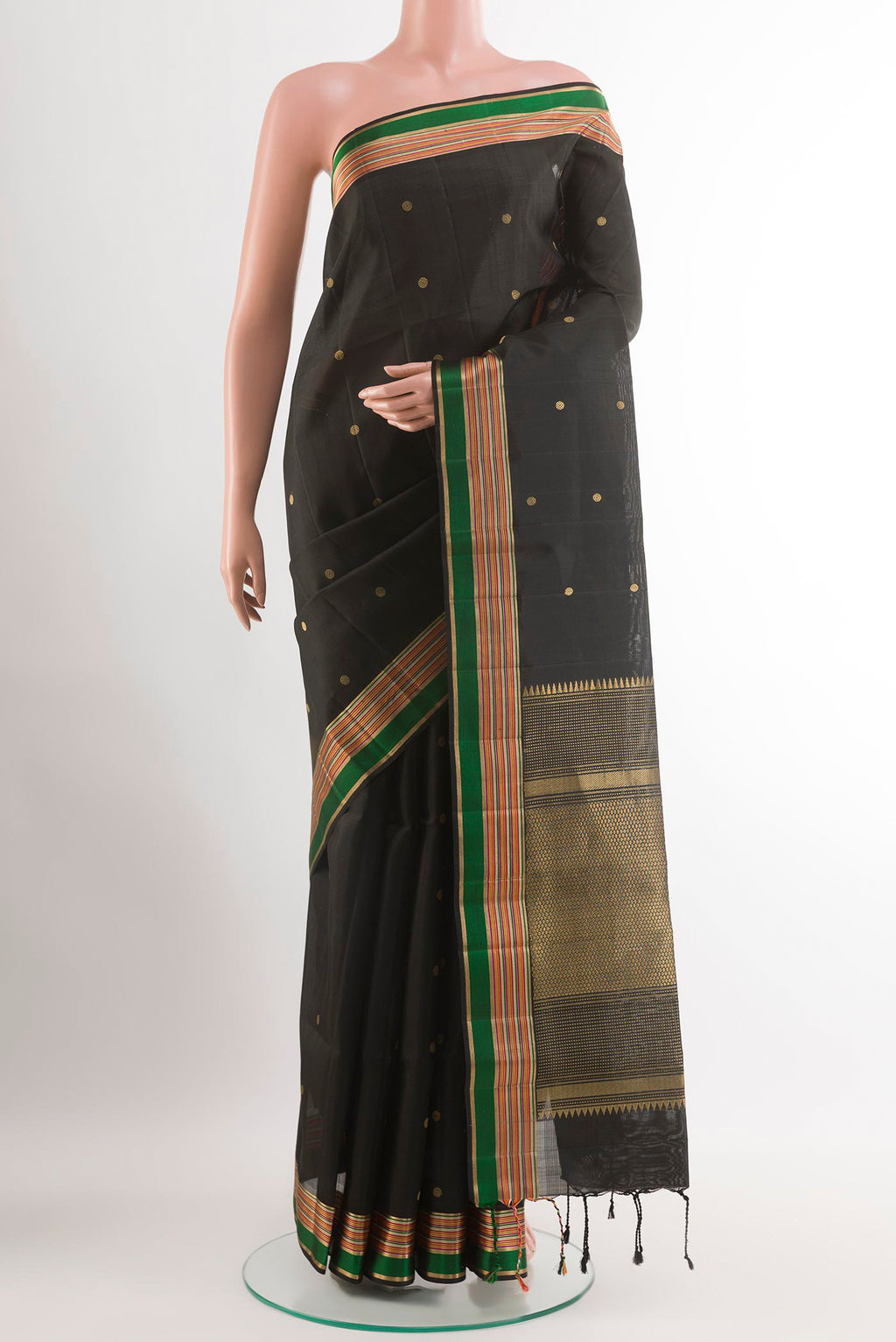 Black Soft Silk Saree with Zari Butta on the body and Zari Border.  displayed on a mannequin