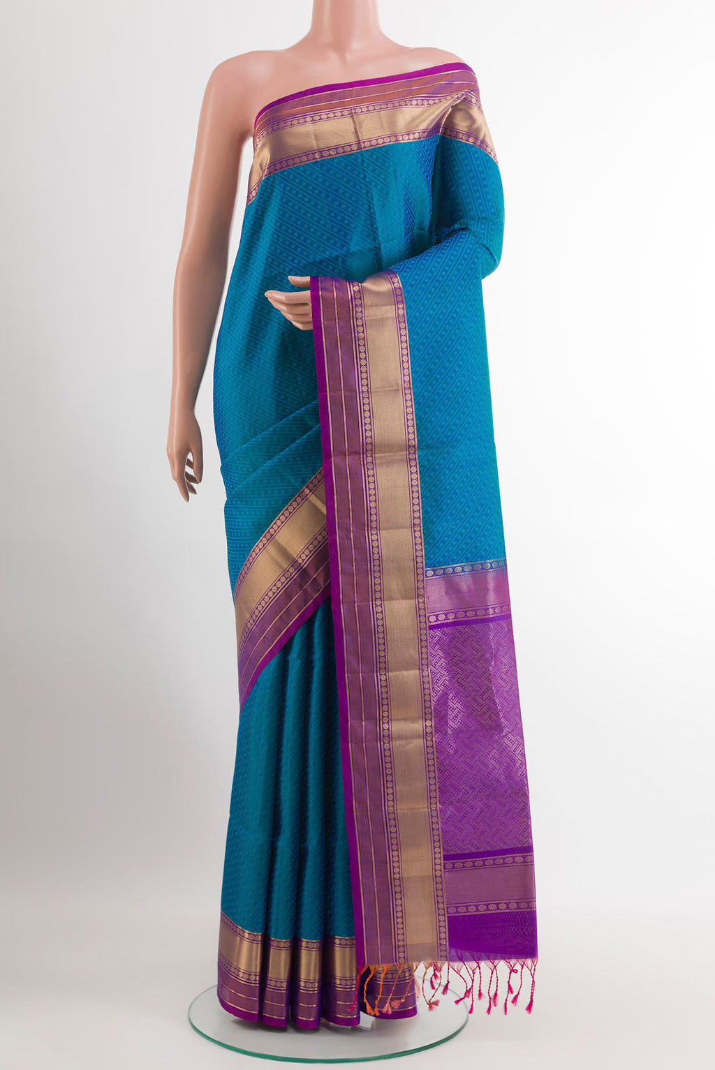 Blue Soft Silk Saree with Jacquard design on the body and Zari Border.  displayed on a mannequin